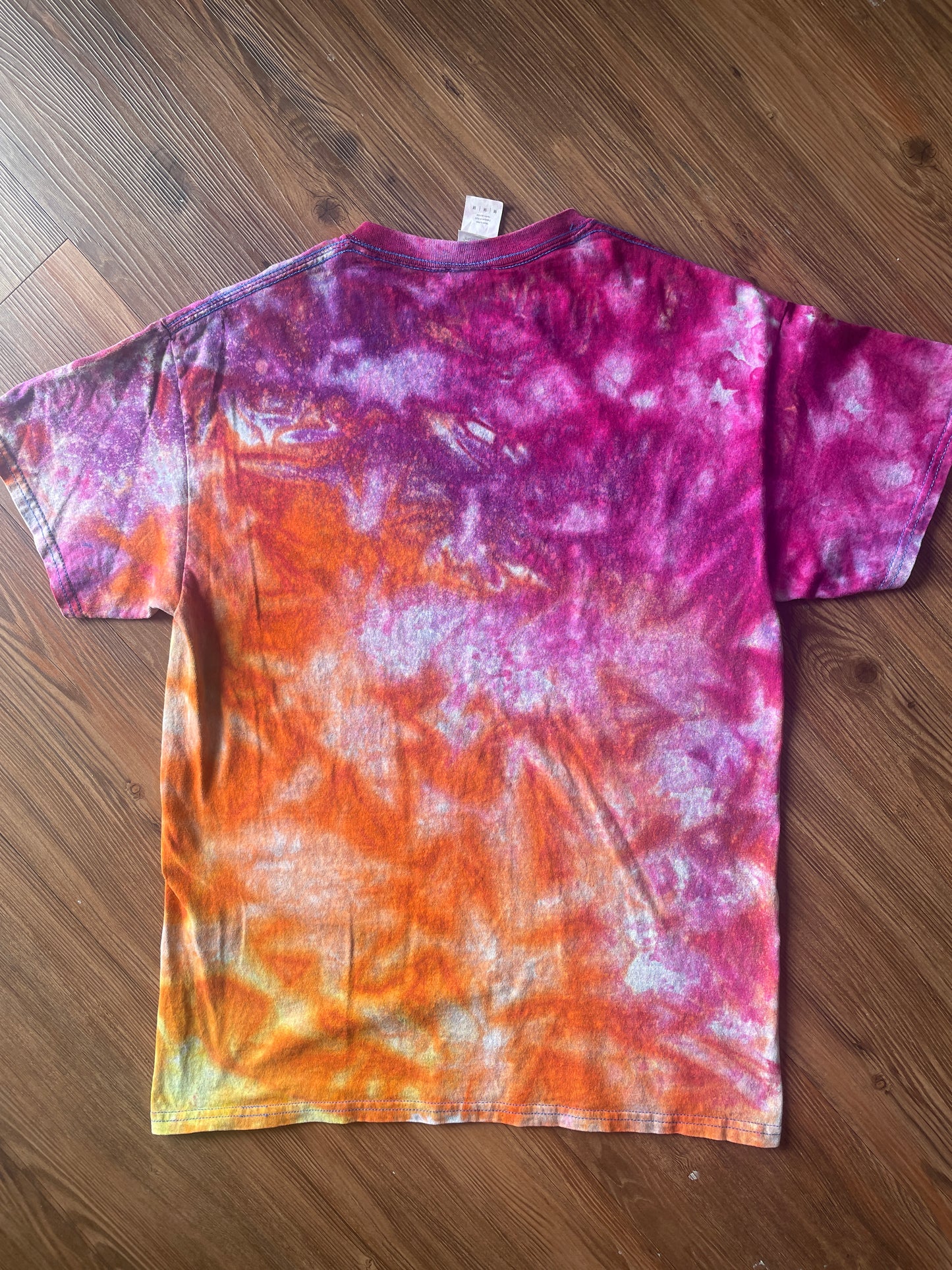 Medium Men’s Moab Utah Handmade Tie Dye T-Shirt with Embroidered Kokopelli Details | Pink and Orange Galaxy Reverse Tie Dye Short Sleeve