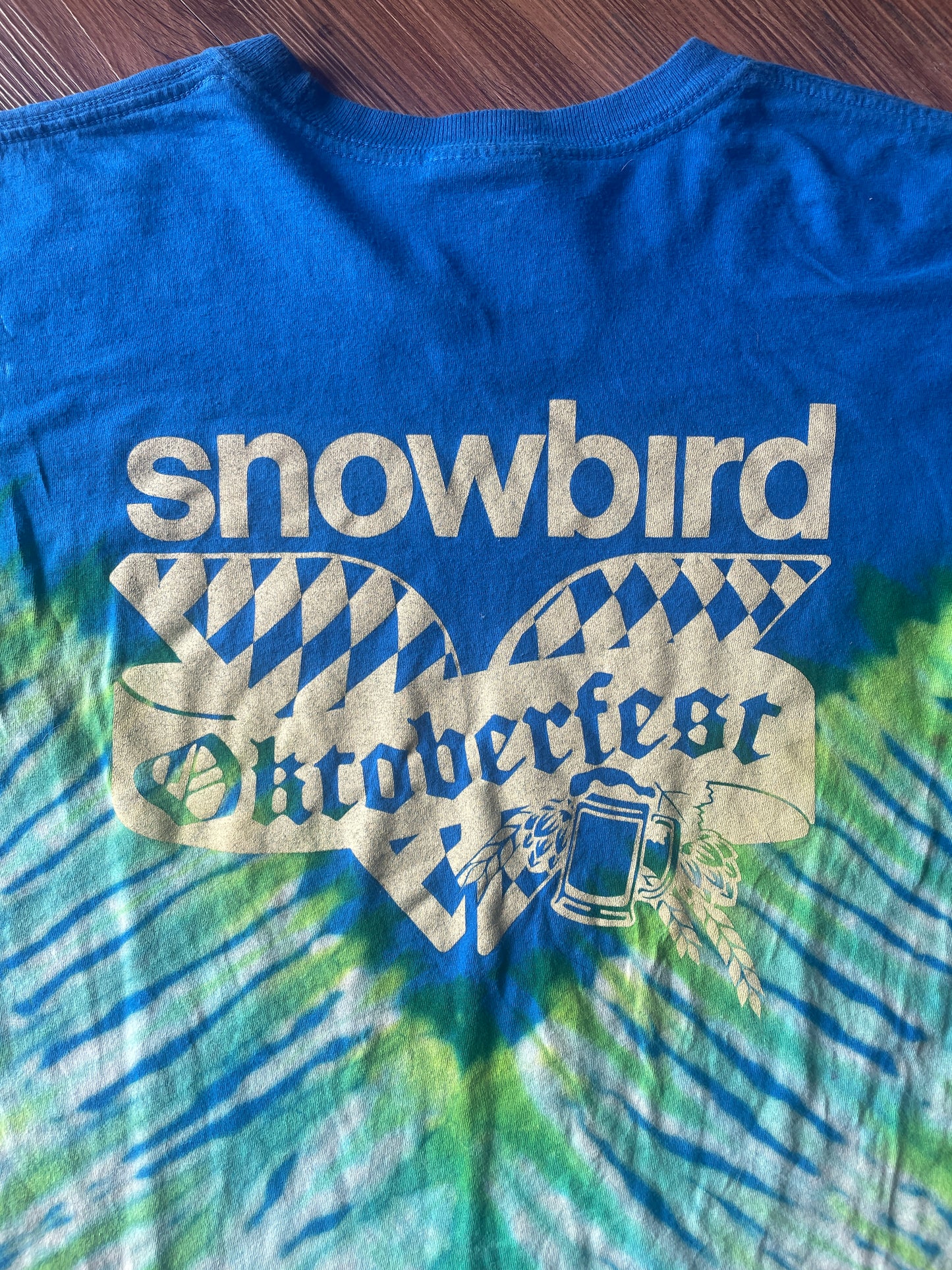 Small Men’s Snowbird Octoberfest Handmade Tie Dye T-Shirt | Utah Snowbird Ski Resort Blue and Green V-Pleated Tie Dye Short Sleeve