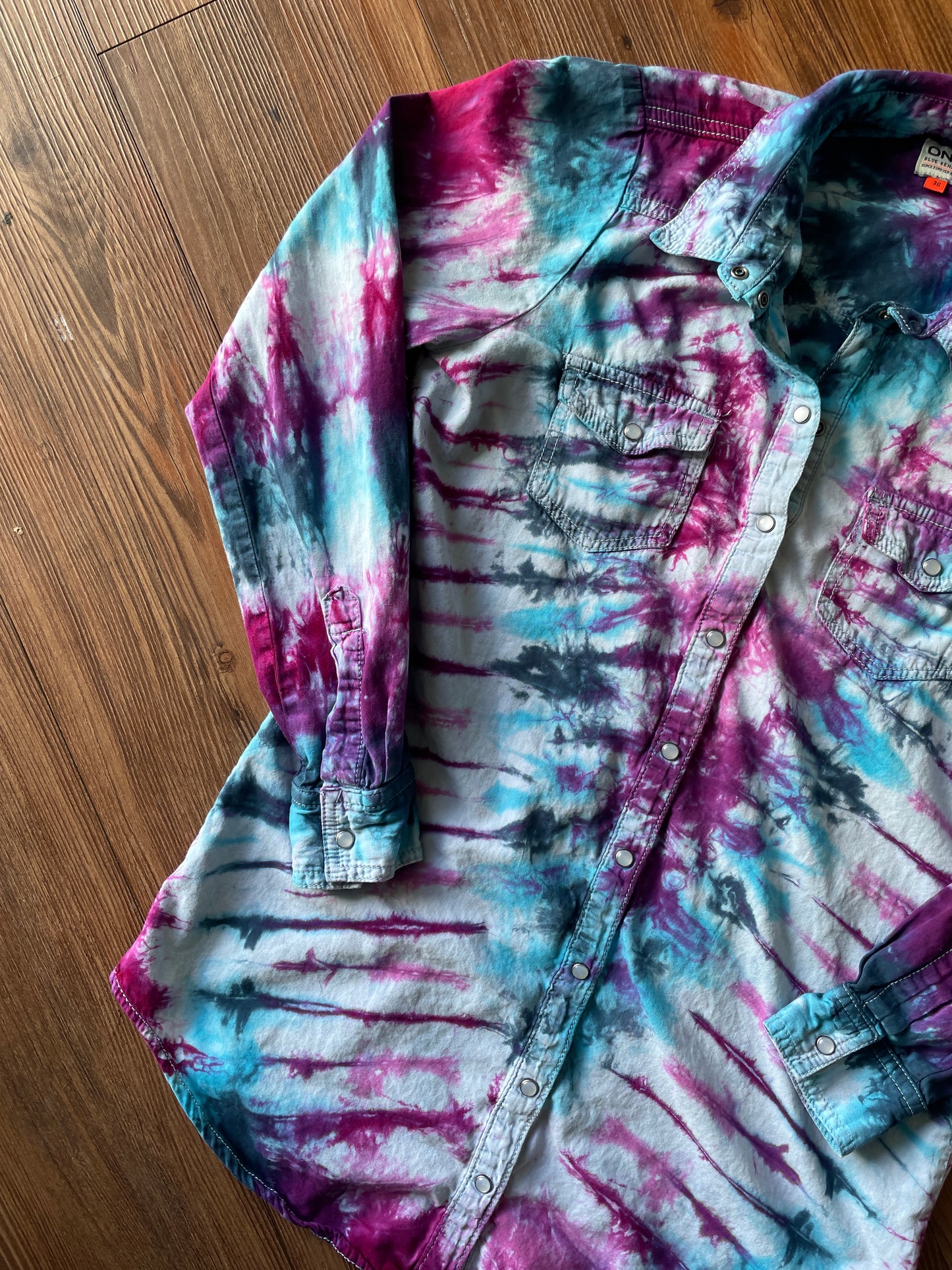 MEDIUM Women’s Handmade Tie Dye Chambray Pearl Snap Shirt | One-Of-a-Kind Blue, Purple, and Pink Pleated Long Sleeve