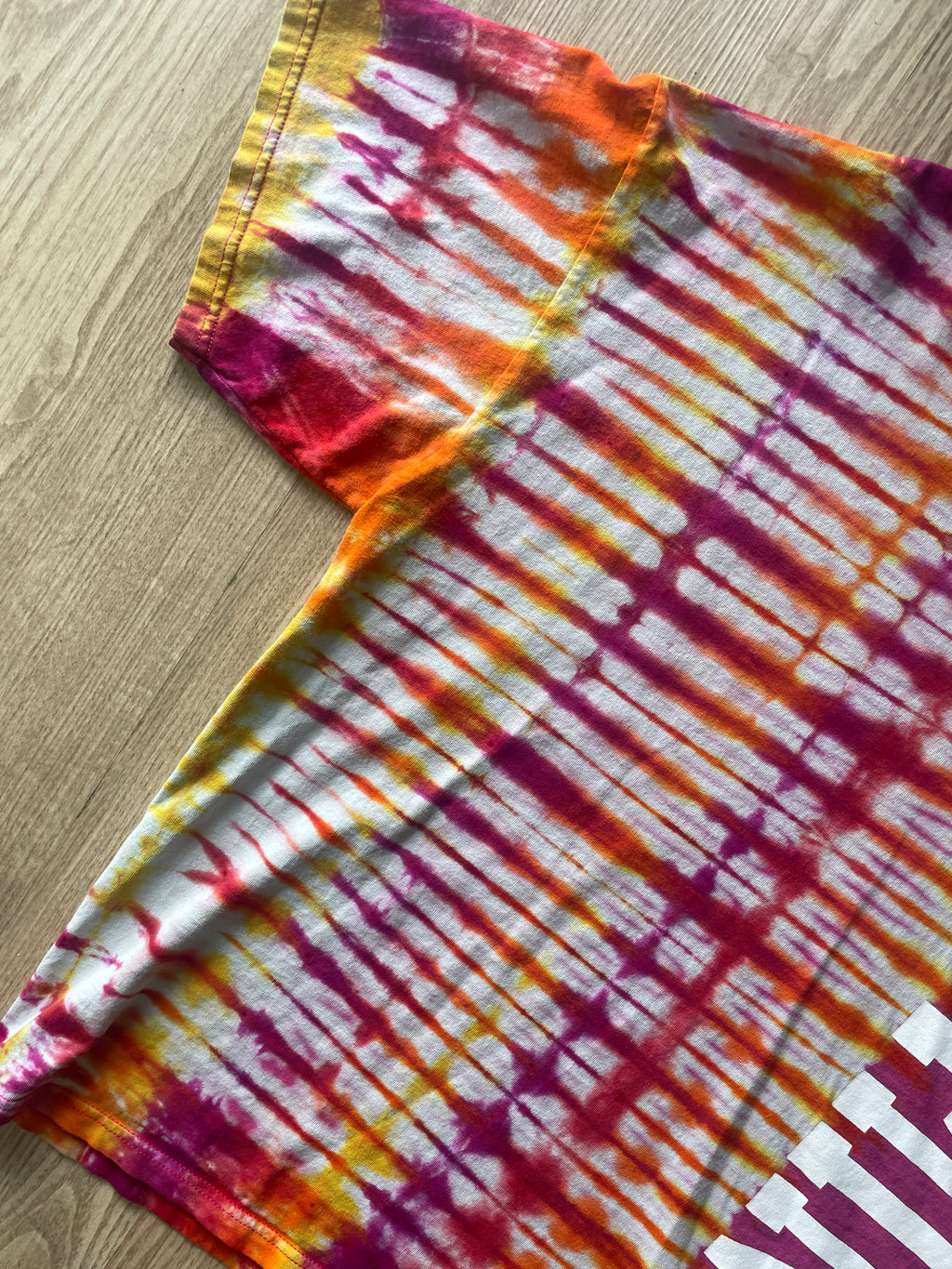 XL Men’s Wyoming Cowboys Handmade Tie Dye T-Shirt | One-Of-a-Kind Pink and Orange/Yellow/Red/Purple Short Sleeve Shirt | Wyoming Gift