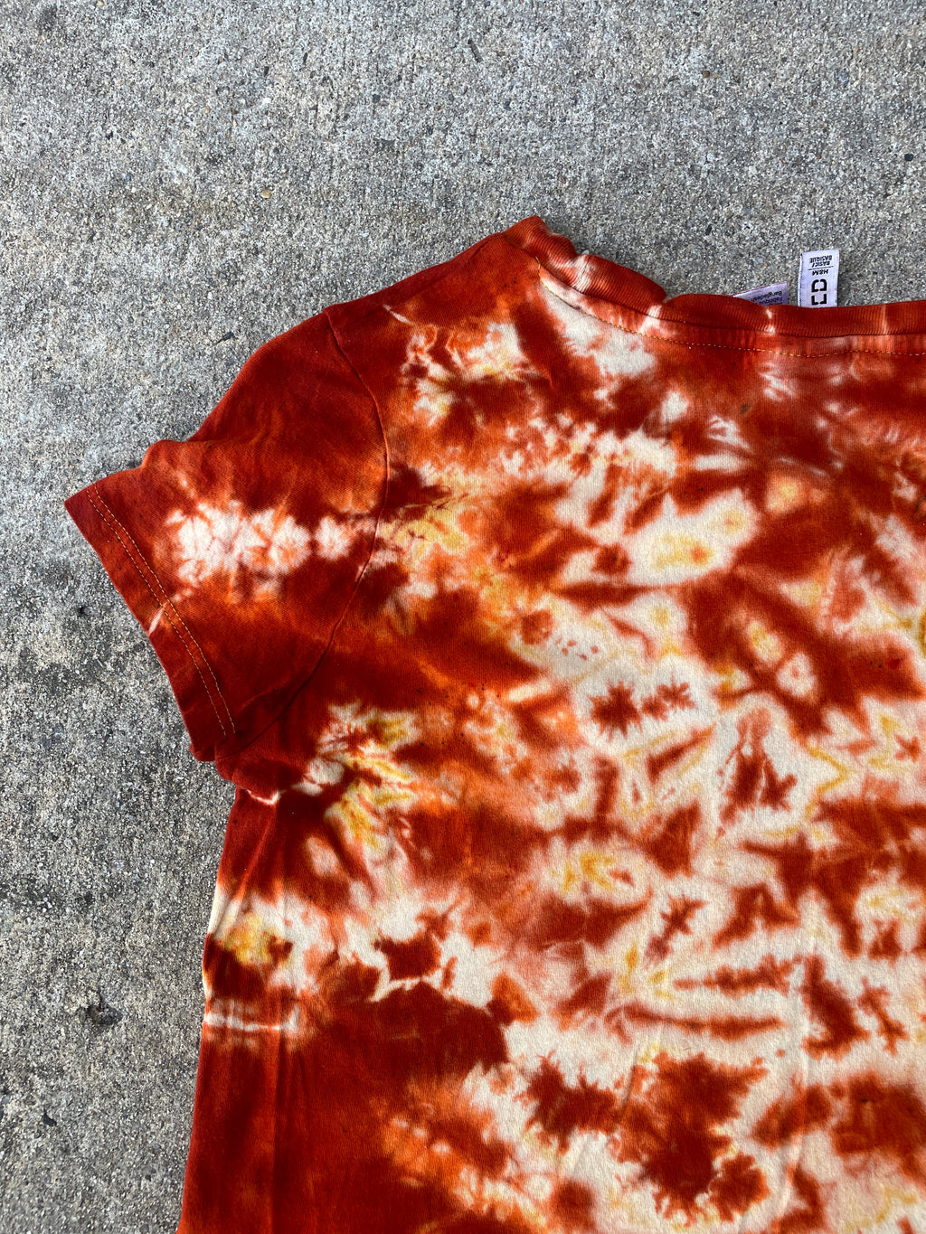 Hand-Printed Skeleton Rock On Orange and Yellow Reverse Tie Dye Short Sleeve T-Shirt | Junior's Size Medium