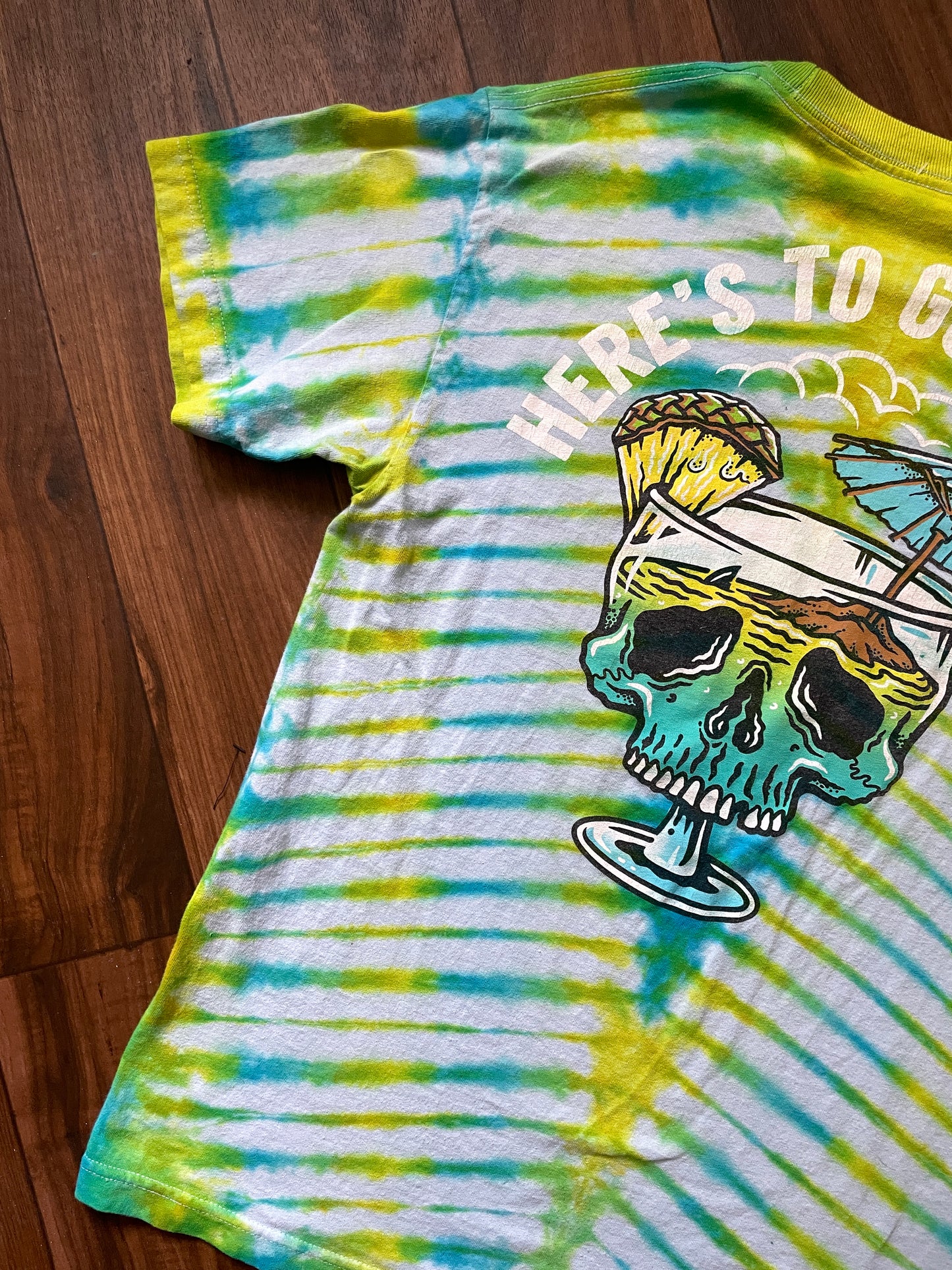 Medium Here's to Good Times Beach Skull Handmade Tie Dye Short Sleeve T-Shirt | One-Of-a-Kind Upcycled Blue and Green Pleated Tie Dye Top