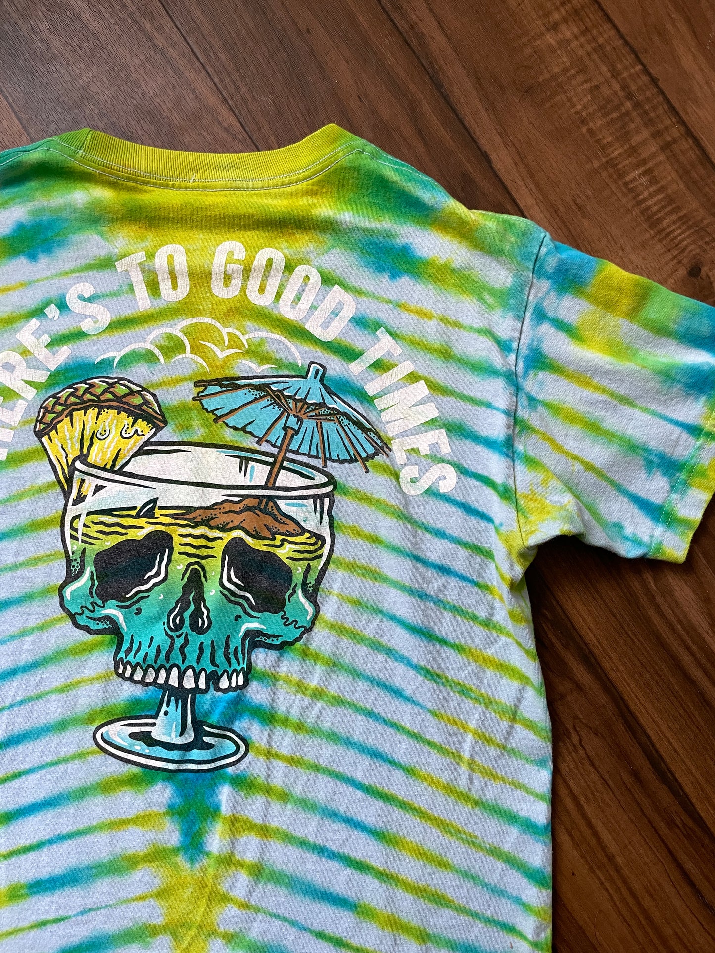 Medium Here's to Good Times Beach Skull Handmade Tie Dye Short Sleeve T-Shirt | One-Of-a-Kind Upcycled Blue and Green Pleated Tie Dye Top