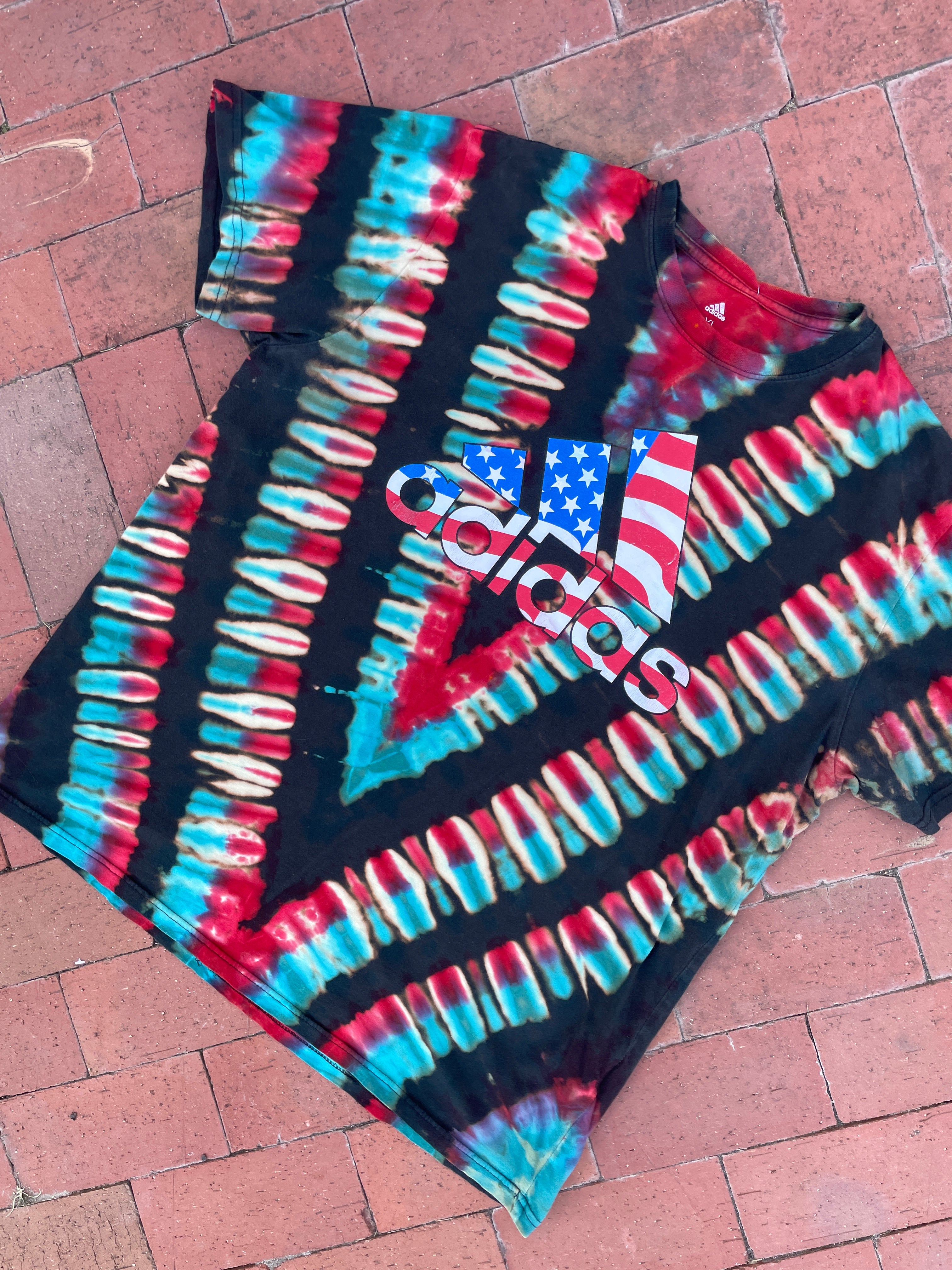XL Men's adidas American Flag Handmade Reverse Tie Dye Short Sleeve T-Shirt | One-Of-a-Kind Upcycled Black, Red, White, and Blue V-Pleated Top