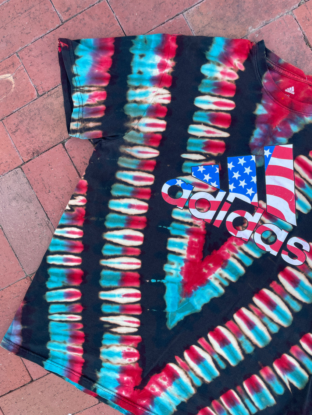 XL Men's adidas American Flag Handmade Reverse Tie Dye Short Sleeve T-Shirt | One-Of-a-Kind Upcycled Black, Red, White, and Blue V-Pleated Top