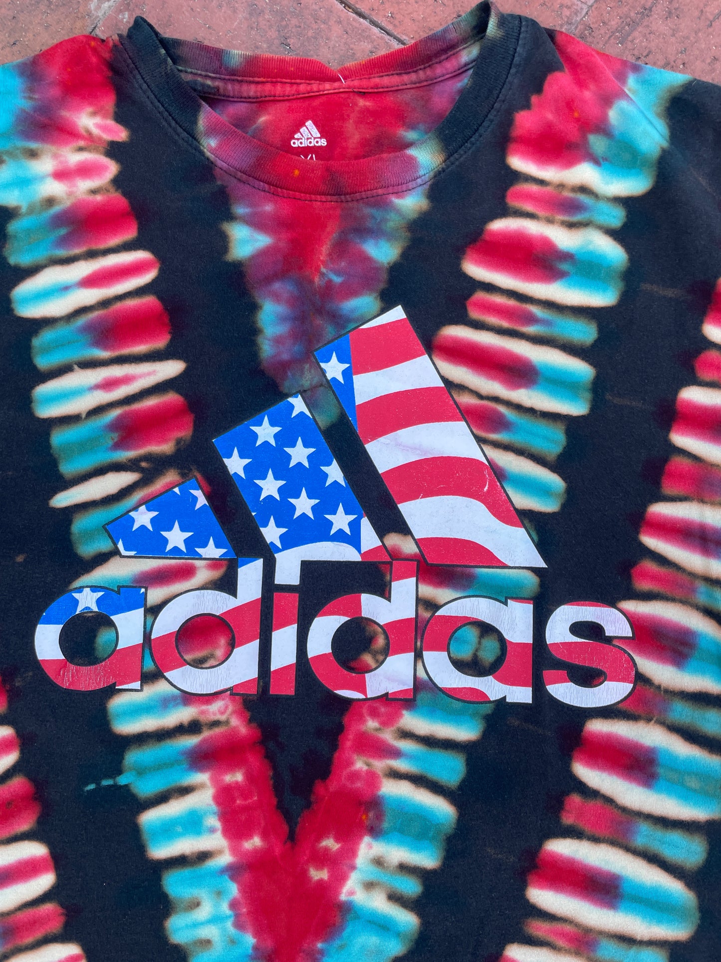 XL Men's adidas American Flag Handmade Reverse Tie Dye Short Sleeve T-Shirt | One-Of-a-Kind Upcycled Black, Red, White, and Blue V-Pleated Top