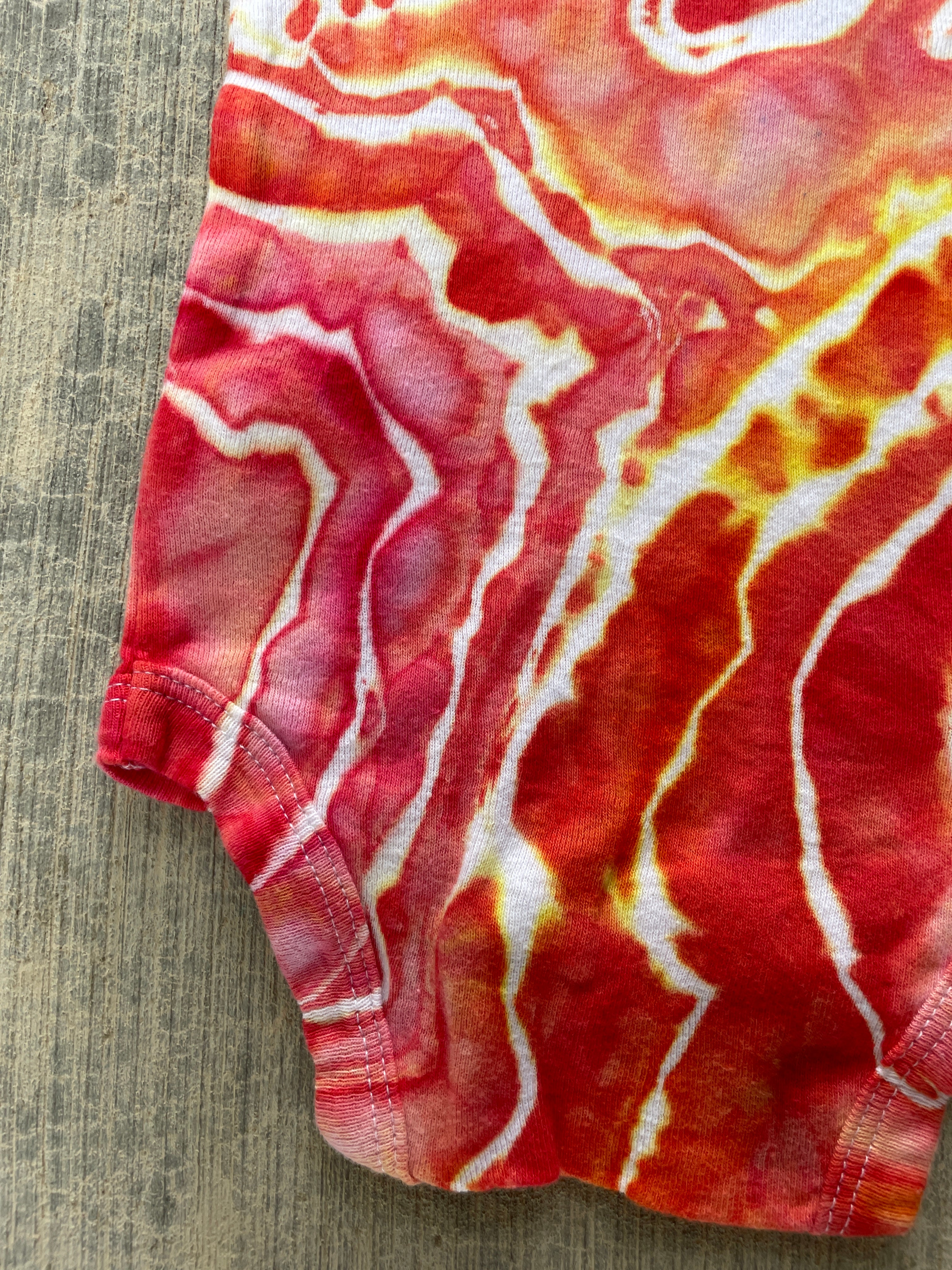 0-3 MO Climbing Carabiner Red, Pink, Orange, and Yellow Geode Short Sleeve Tie Dye Baby Onesie