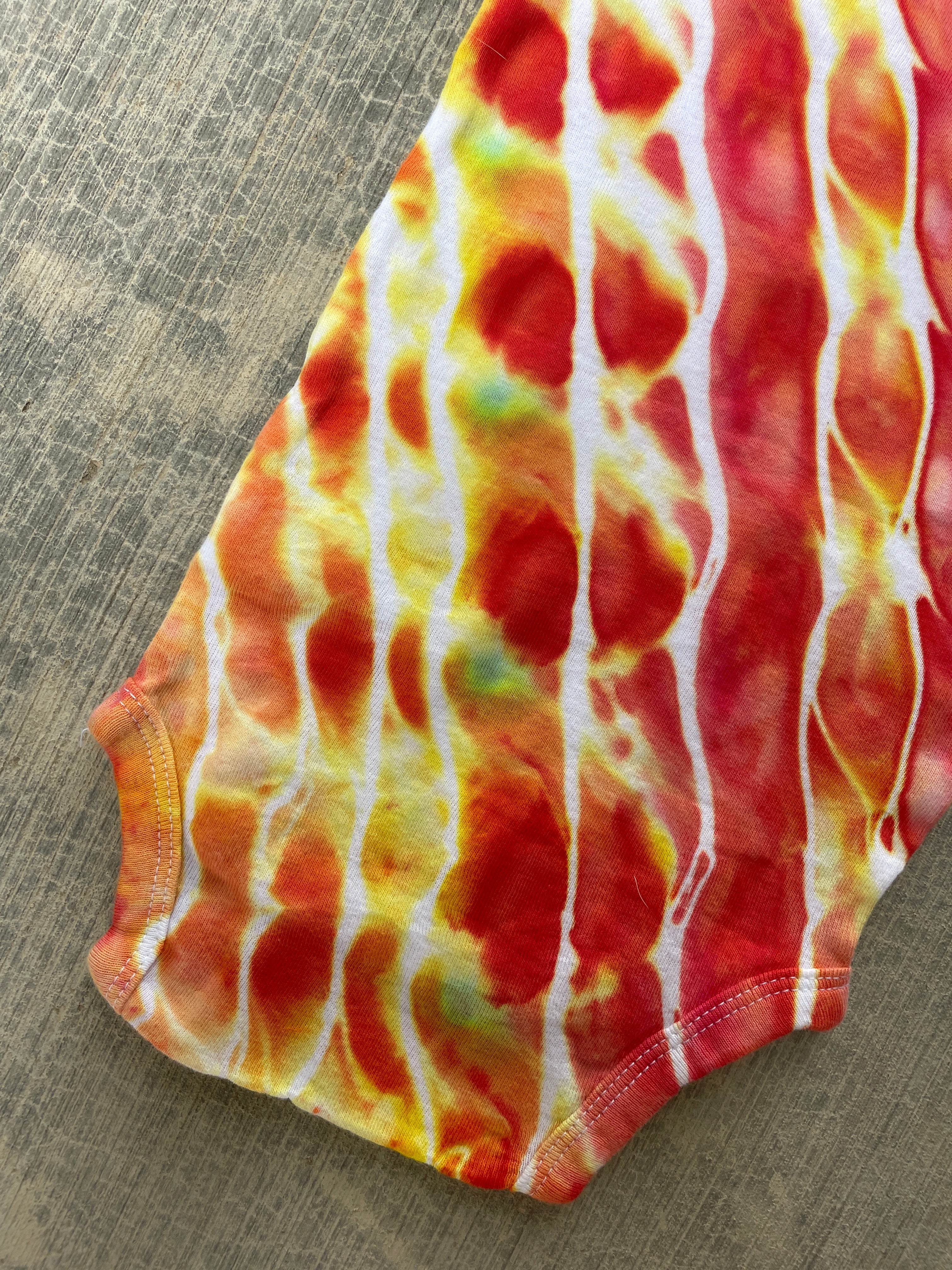 12 MO Red, Orange, and Yellow Geode Short Sleeve Tie Dye Baby Onesie