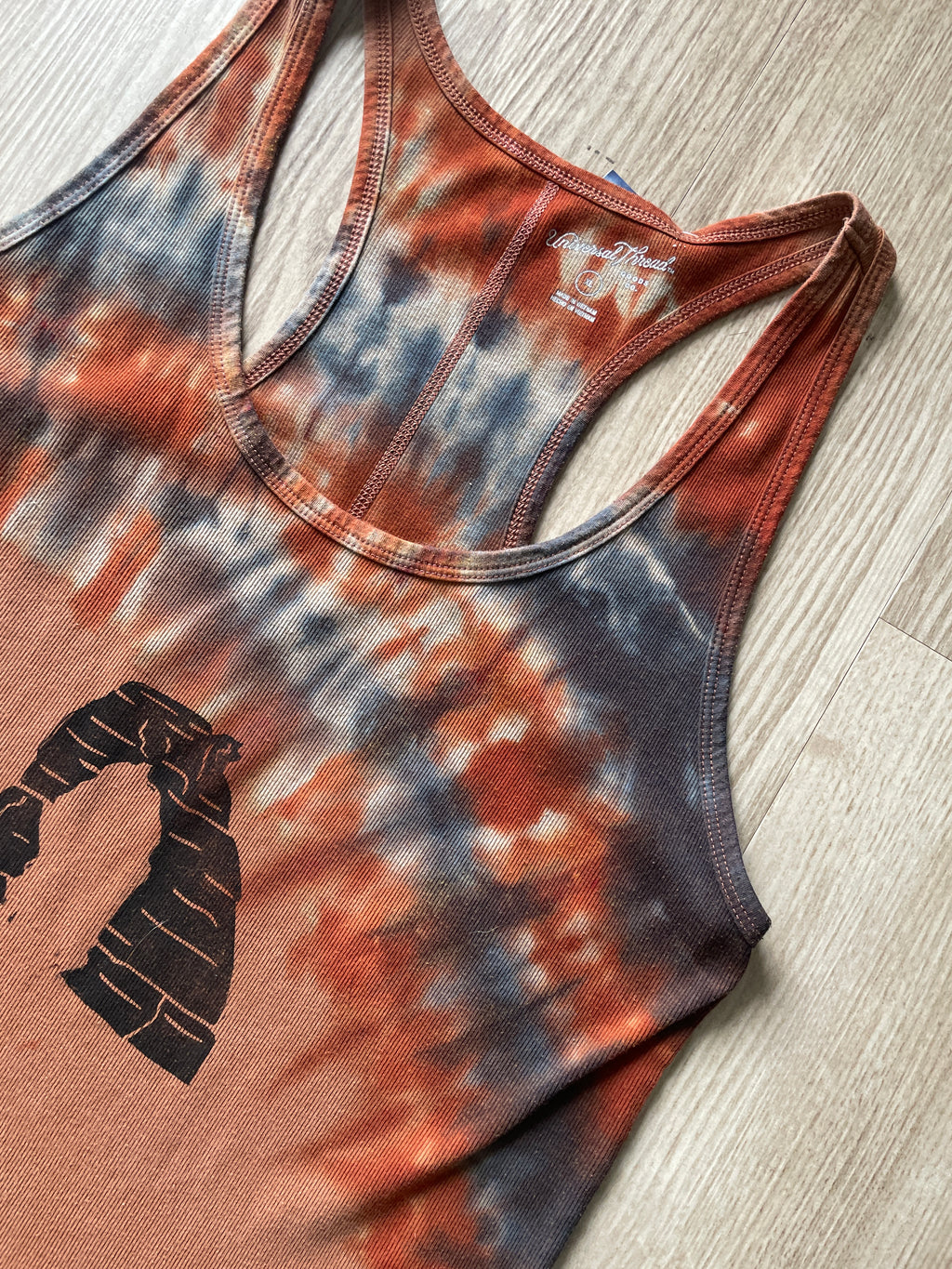 XL Women's Hand-Printed Delicate Arch Reverse Tie Dye Tank Top | Handmade One-Of-a-Kind Upcycled Orange and Black Sleeveless Top