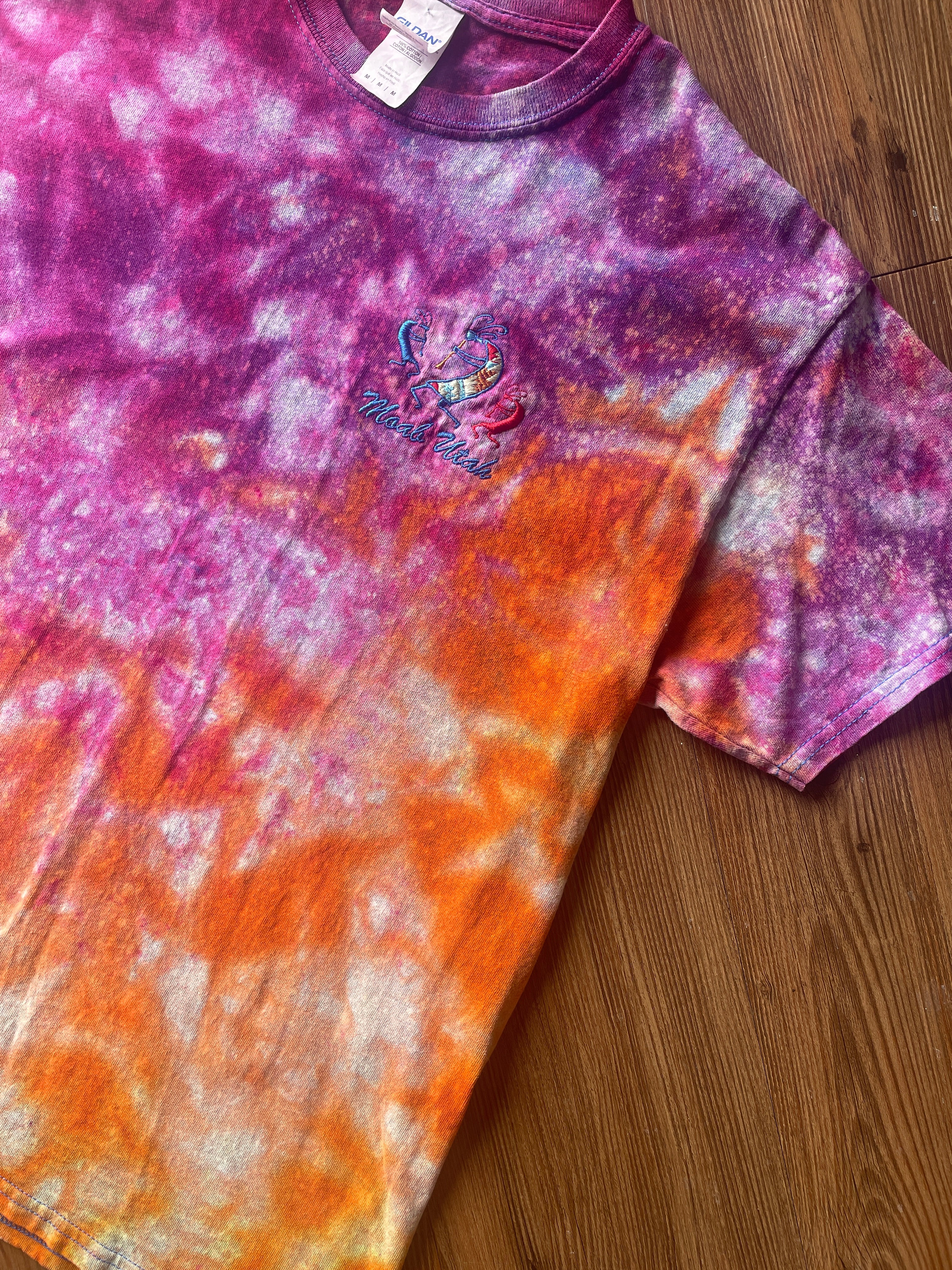 Medium Men’s Moab Utah Handmade Tie Dye T-Shirt with Embroidered Kokopelli Details | Pink and Orange Galaxy Reverse Tie Dye Short Sleeve