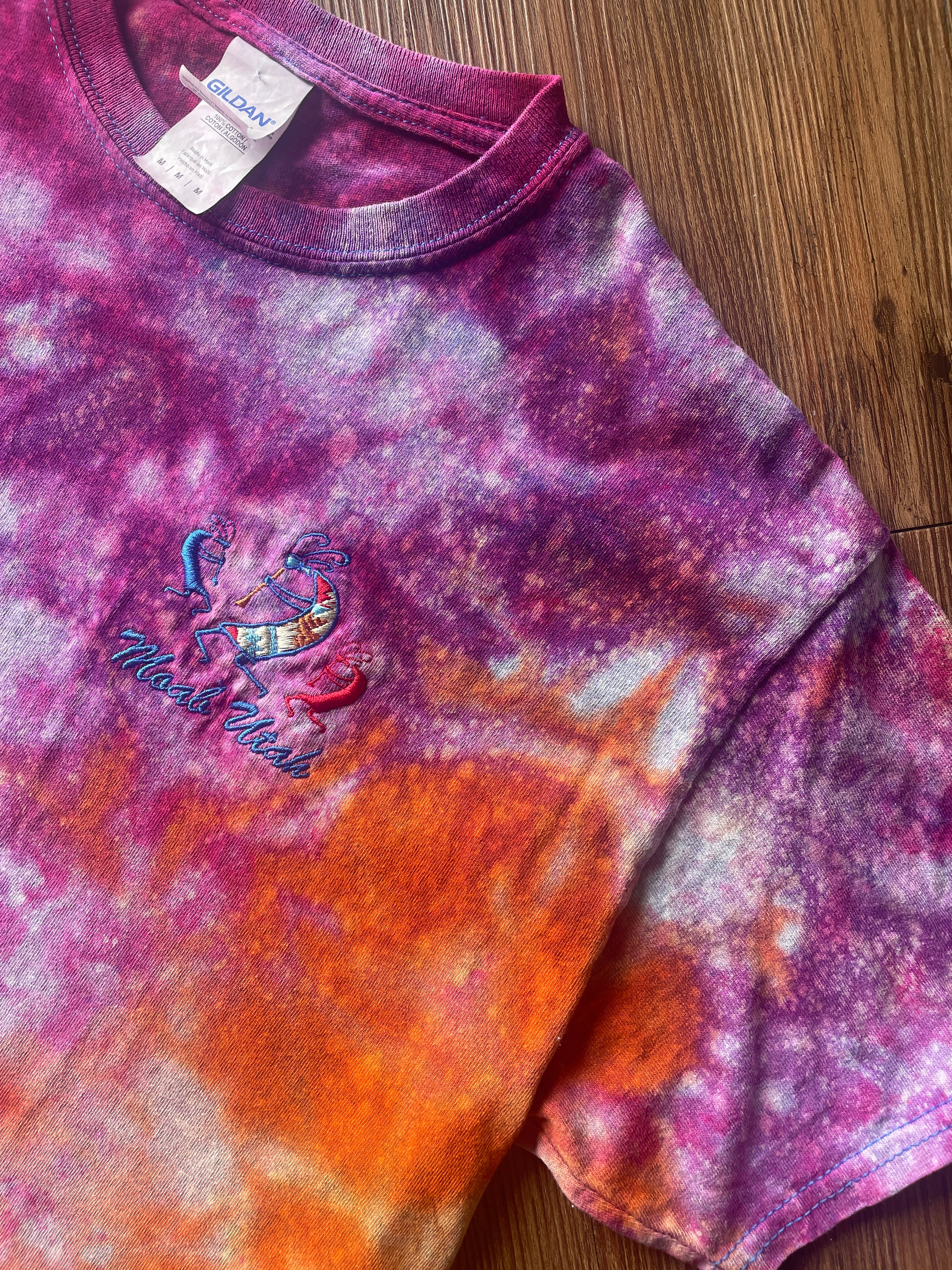 Medium Men’s Moab Utah Handmade Tie Dye T-Shirt with Embroidered Kokopelli Details | Pink and Orange Galaxy Reverse Tie Dye Short Sleeve