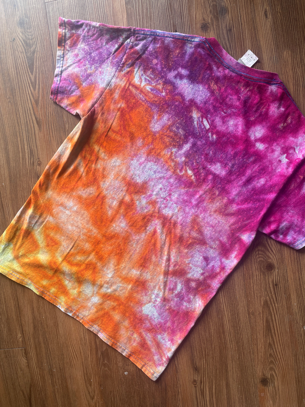 Medium Men’s Moab Utah Handmade Tie Dye T-Shirt with Embroidered Kokopelli Details | Pink and Orange Galaxy Reverse Tie Dye Short Sleeve