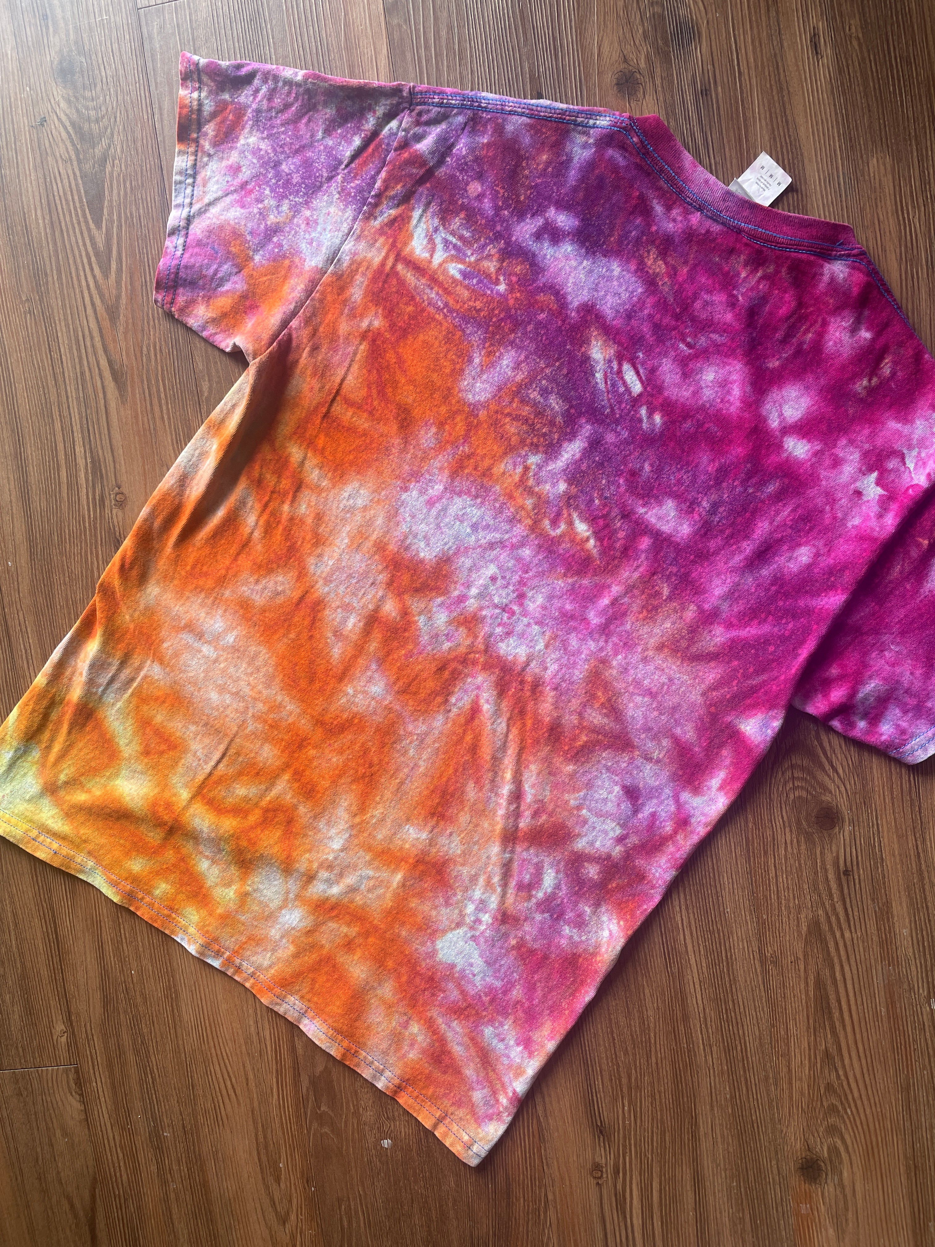 Medium Men’s Moab Utah Handmade Tie Dye T-Shirt with Embroidered Kokopelli Details | Pink and Orange Galaxy Reverse Tie Dye Short Sleeve