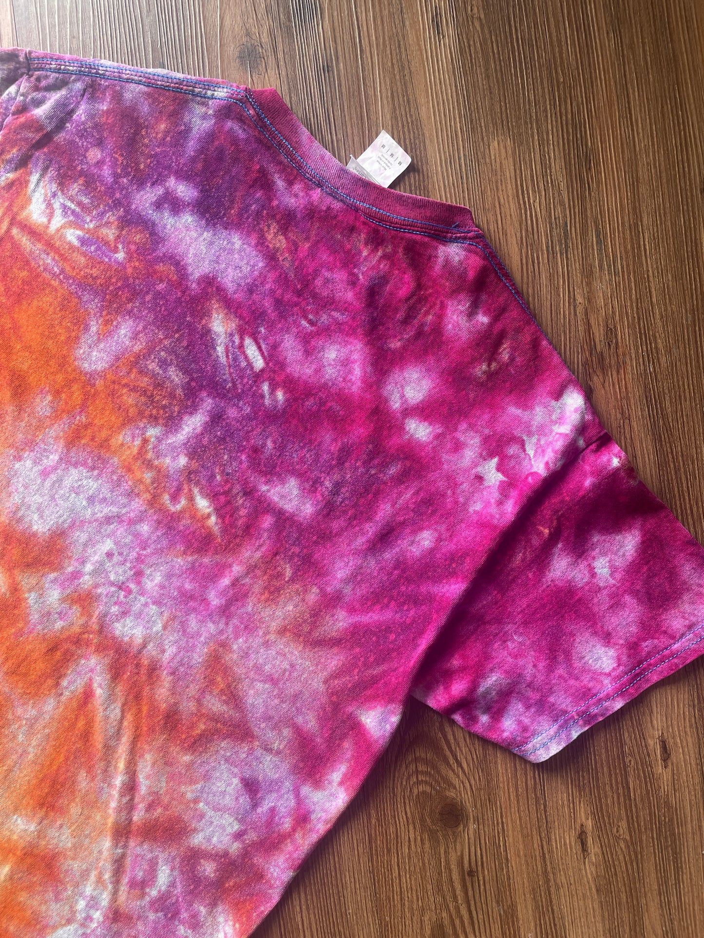 Medium Men’s Moab Utah Handmade Tie Dye T-Shirt with Embroidered Kokopelli Details | Pink and Orange Galaxy Reverse Tie Dye Short Sleeve