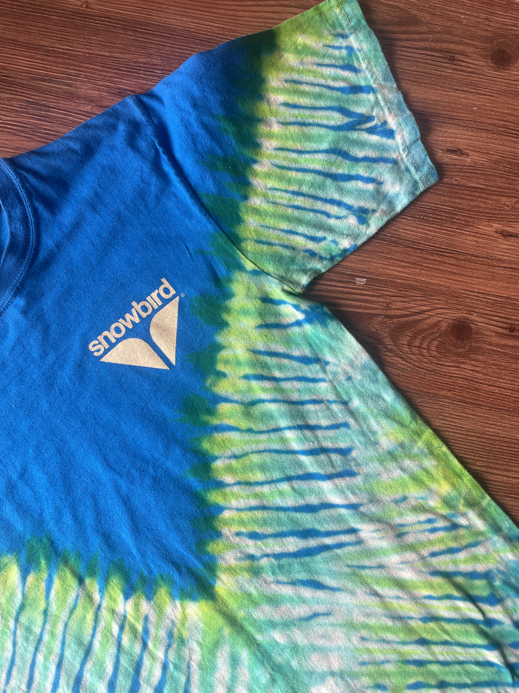 Small Men’s Snowbird Octoberfest Handmade Tie Dye T-Shirt | Utah Snowbird Ski Resort Blue and Green V-Pleated Tie Dye Short Sleeve