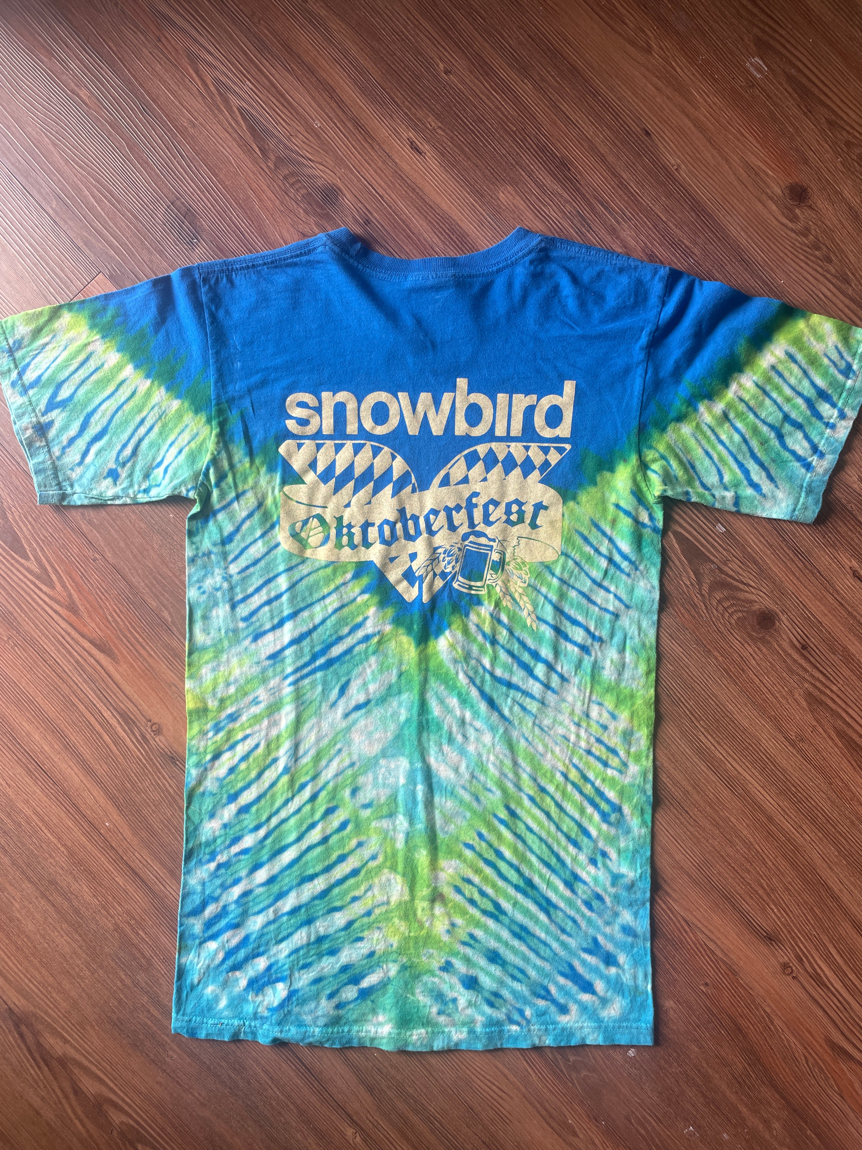 Small Men’s Snowbird Octoberfest Handmade Tie Dye T-Shirt | Utah Snowbird Ski Resort Blue and Green V-Pleated Tie Dye Short Sleeve