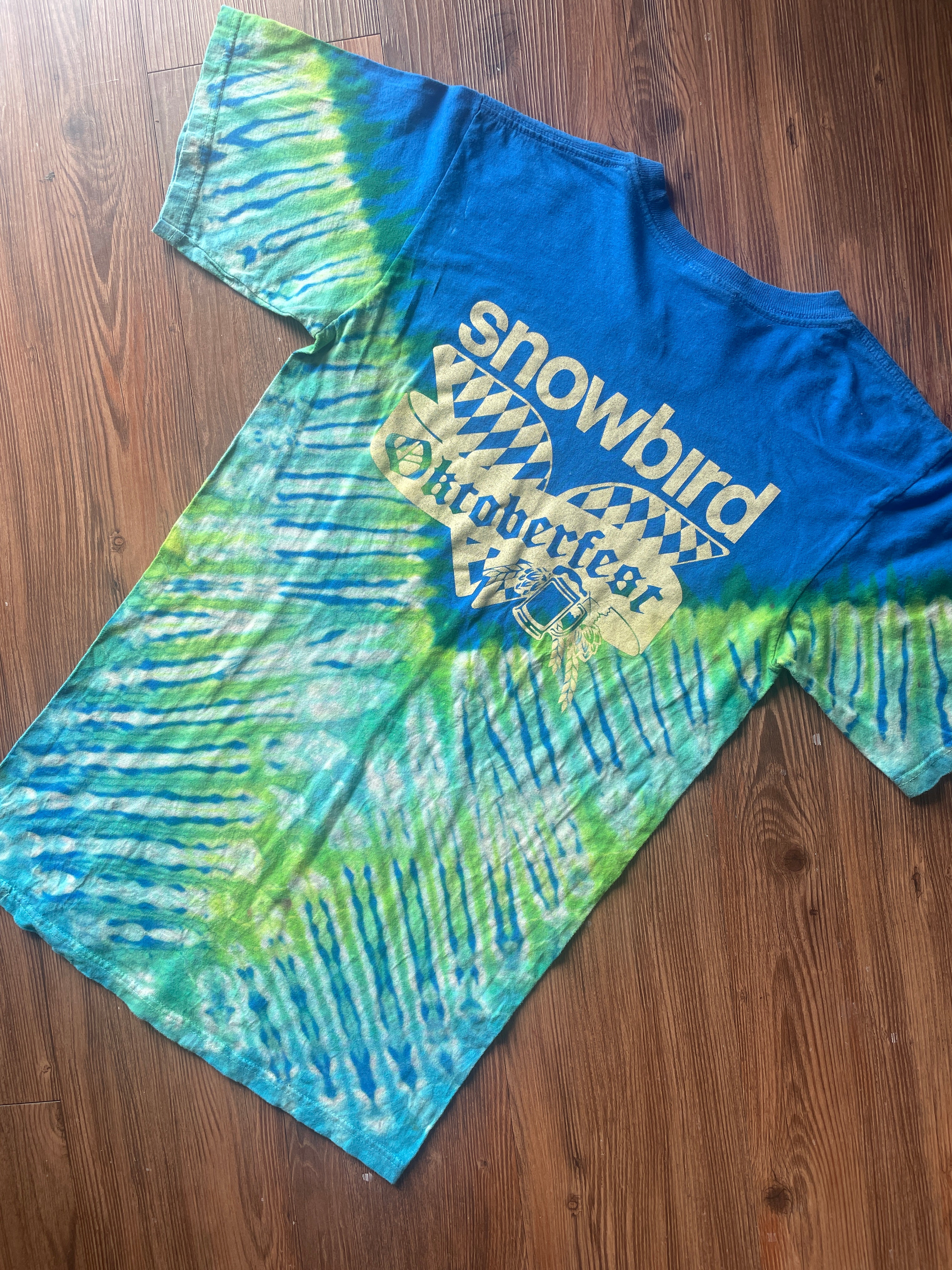 Small Men’s Snowbird Octoberfest Handmade Tie Dye T-Shirt | Utah Snowbird Ski Resort Blue and Green V-Pleated Tie Dye Short Sleeve