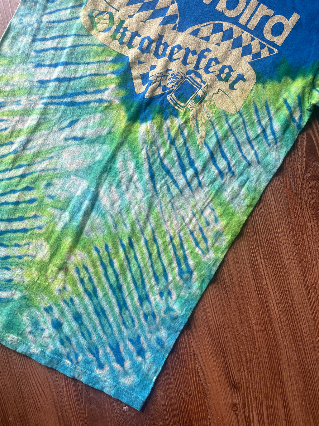 Small Men’s Snowbird Octoberfest Handmade Tie Dye T-Shirt | Utah Snowbird Ski Resort Blue and Green V-Pleated Tie Dye Short Sleeve