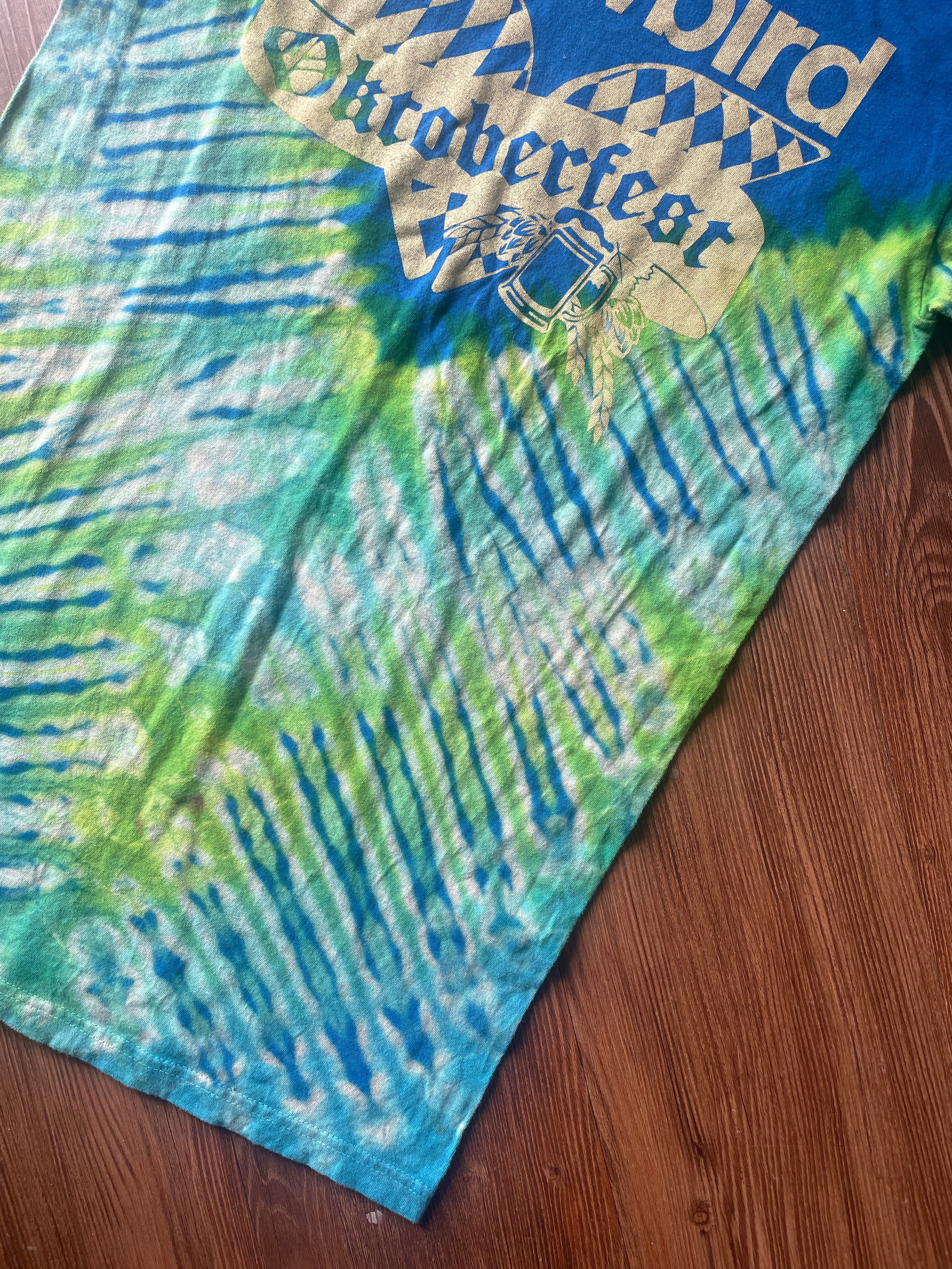 Small Men’s Snowbird Octoberfest Handmade Tie Dye T-Shirt | Utah Snowbird Ski Resort Blue and Green V-Pleated Tie Dye Short Sleeve