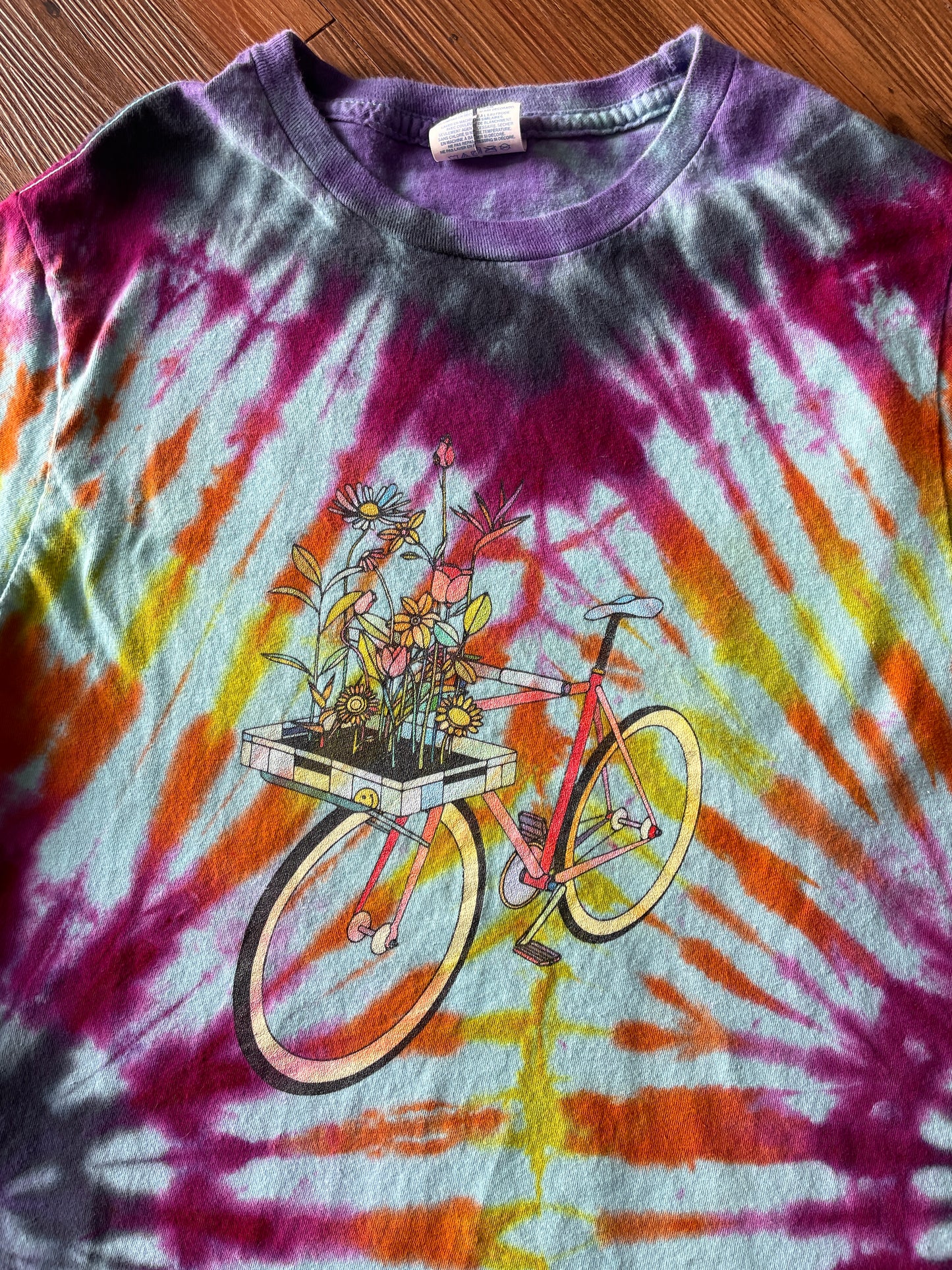 Small Women’s Floral Bicycle Handmade Reverse Tie Dye T-Shirt | Blue, Pink, and Orange Pleated Tie Dye Short Sleeve