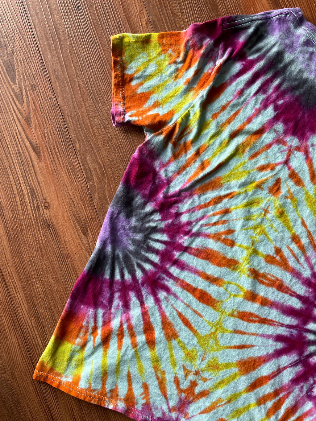 Small Women’s Floral Bicycle Handmade Reverse Tie Dye T-Shirt | Blue, Pink, and Orange Pleated Tie Dye Short Sleeve