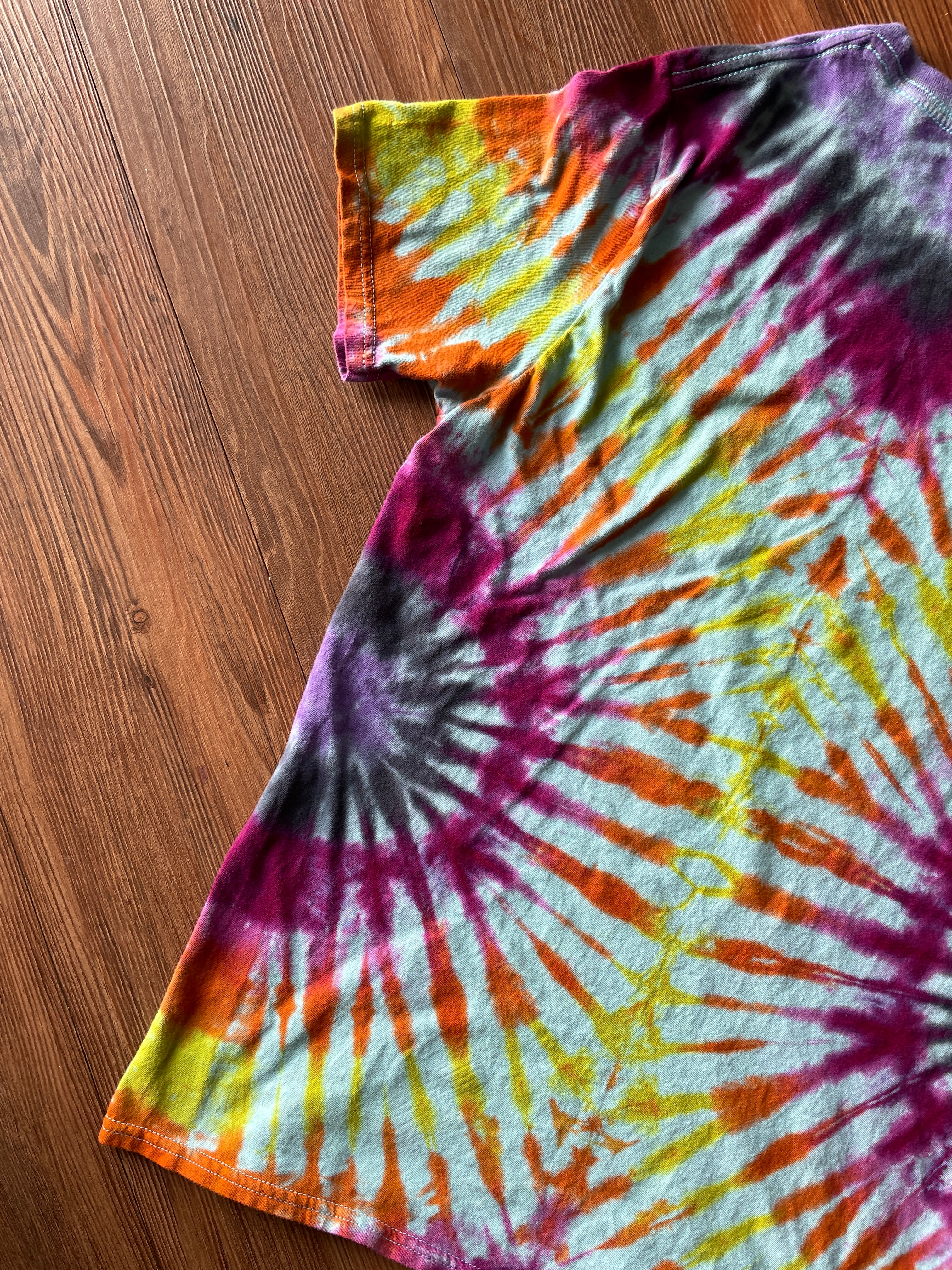 Small Women’s Floral Bicycle Handmade Reverse Tie Dye T-Shirt | Blue, Pink, and Orange Pleated Tie Dye Short Sleeve