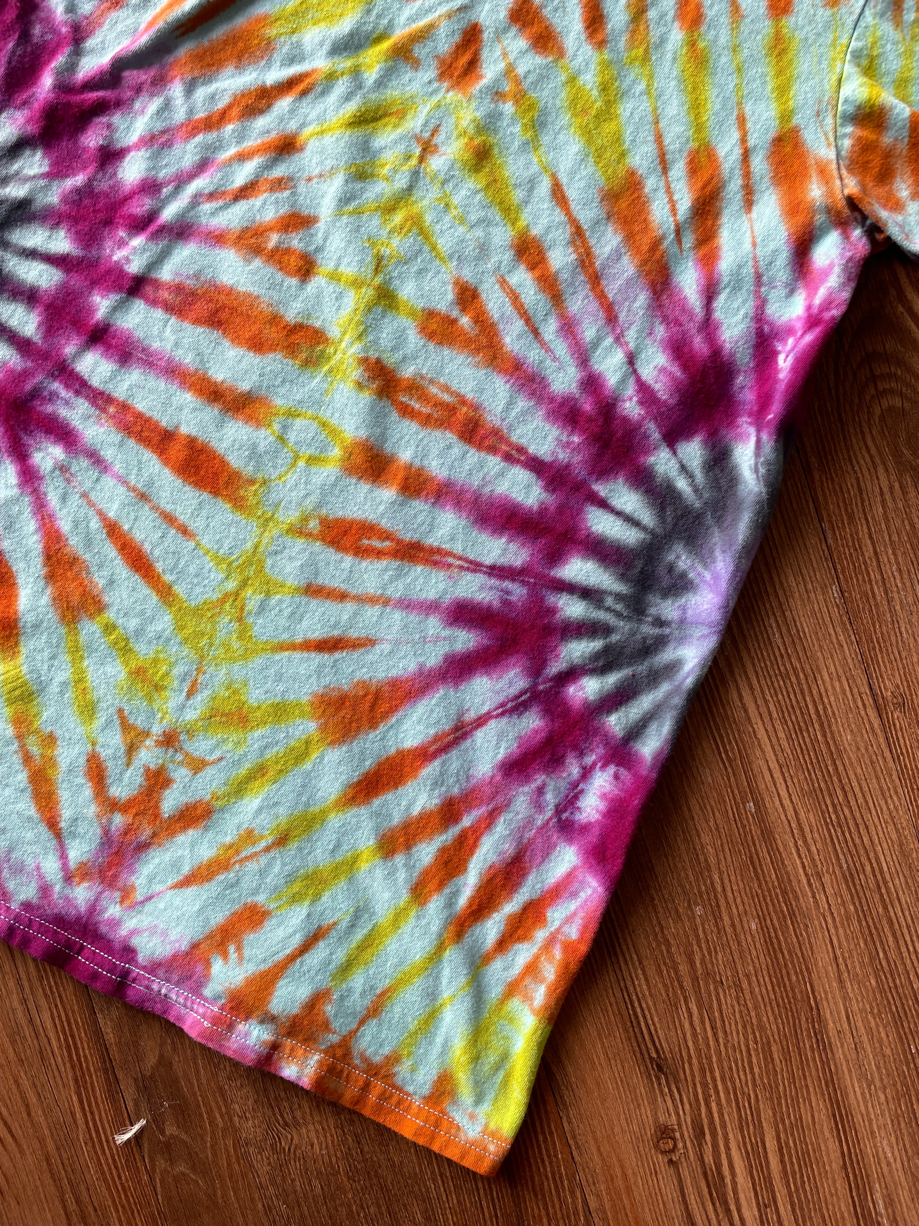 Small Women’s Floral Bicycle Handmade Reverse Tie Dye T-Shirt | Blue, Pink, and Orange Pleated Tie Dye Short Sleeve