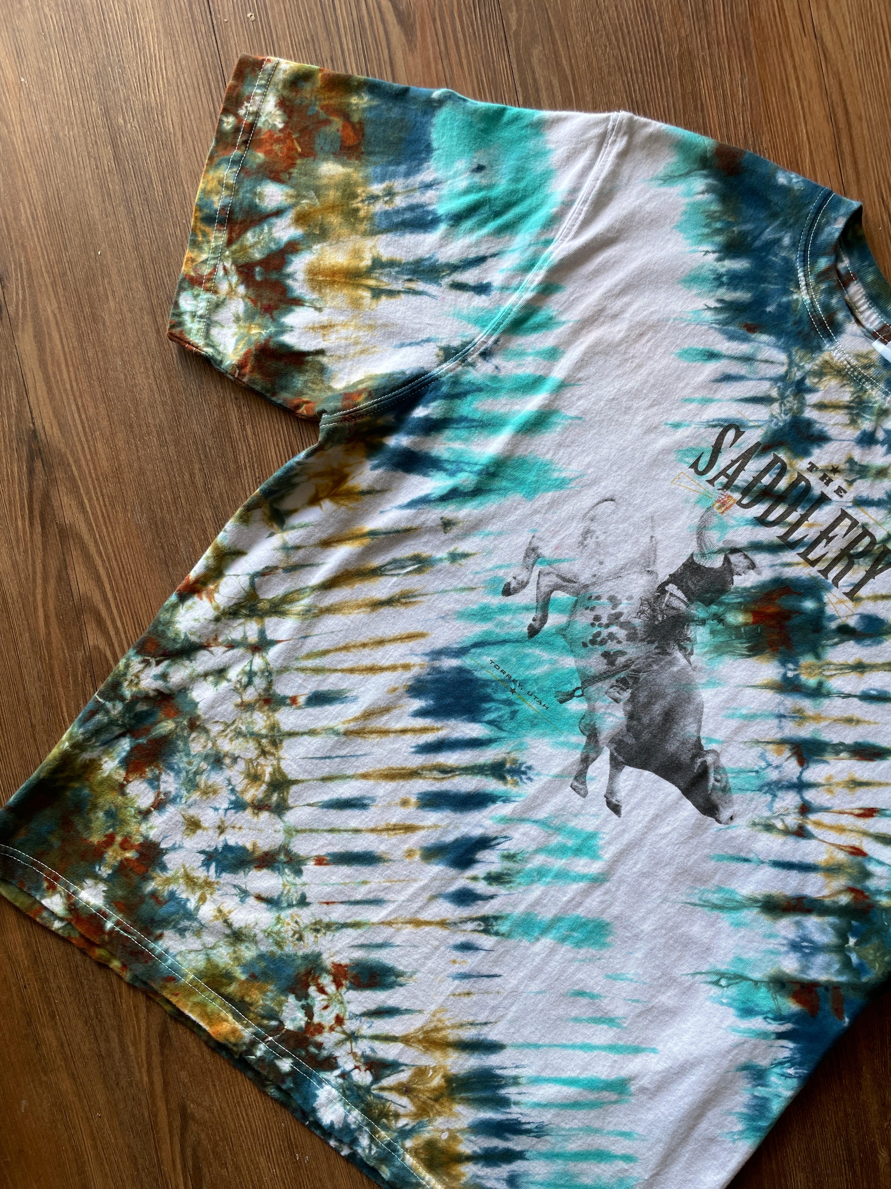 LARGE Men’s The Saddlery Bullrider Handmade Tie Dye T-Shirt | One-Of-a-Kind White, Blue, Green, and Brown Short Sleeve
