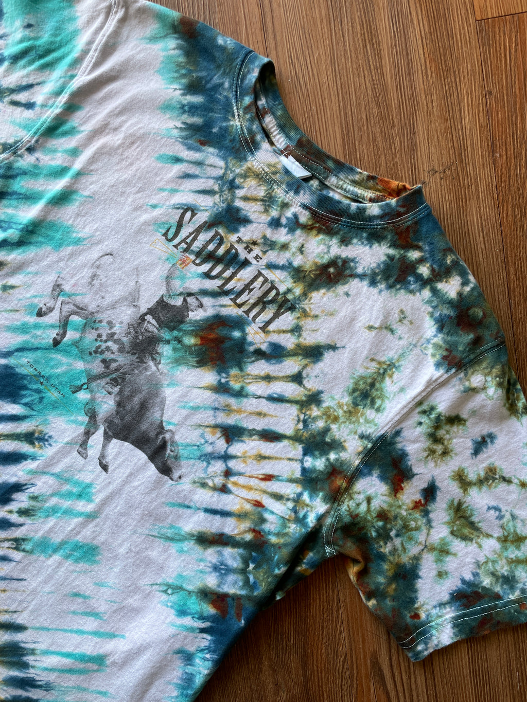 LARGE Men’s The Saddlery Bullrider Handmade Tie Dye T-Shirt | One-Of-a-Kind White, Blue, Green, and Brown Short Sleeve