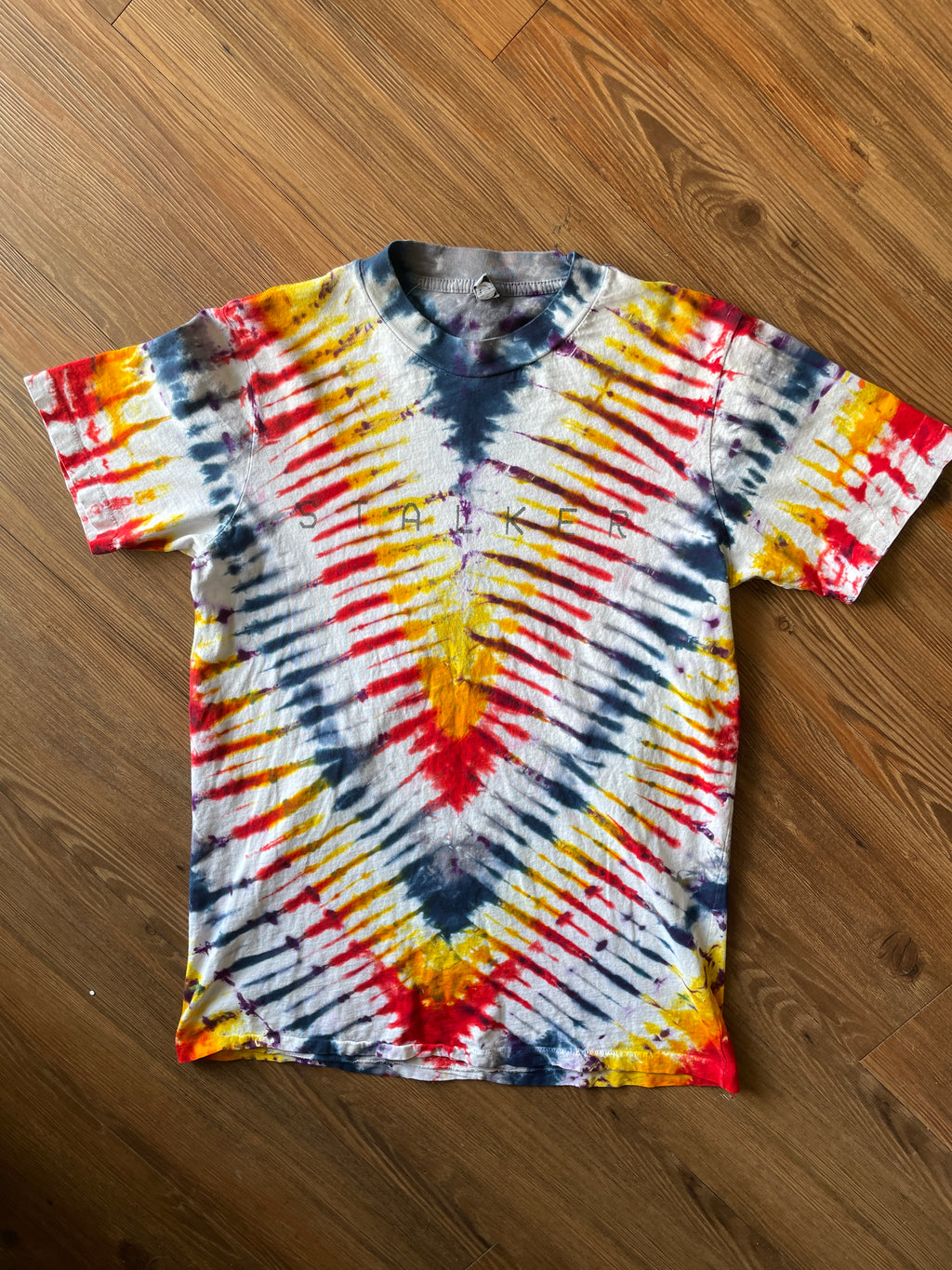 Small Men’s Local Boogeyman STALKER Handmade Tie Dye T-Shirt | Red, Orange, Yellow, and Black Pleated Tie Dye Short Sleeve