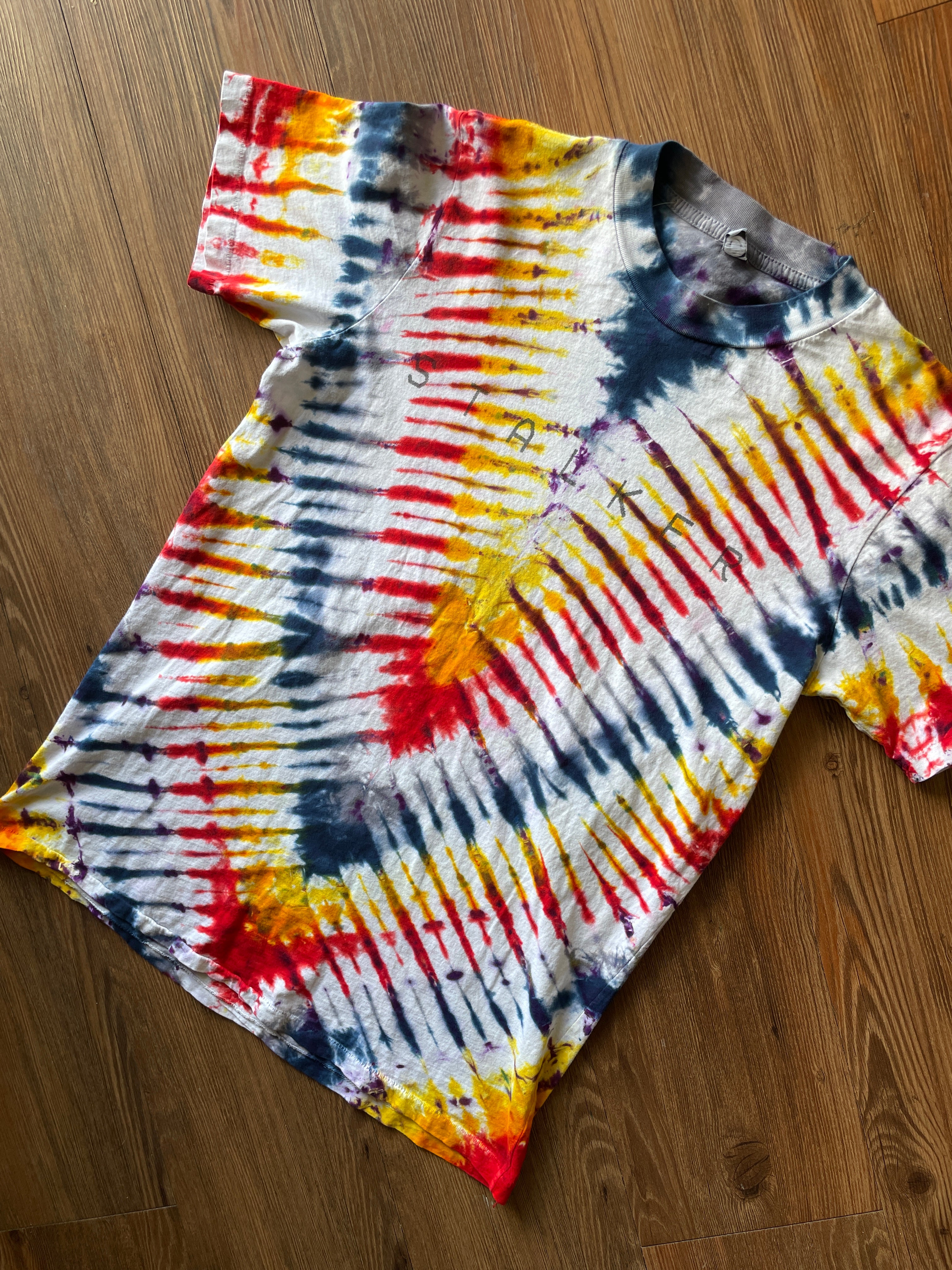 Small Men’s Local Boogeyman STALKER Handmade Tie Dye T-Shirt | Red, Orange, Yellow, and Black Pleated Tie Dye Short Sleeve