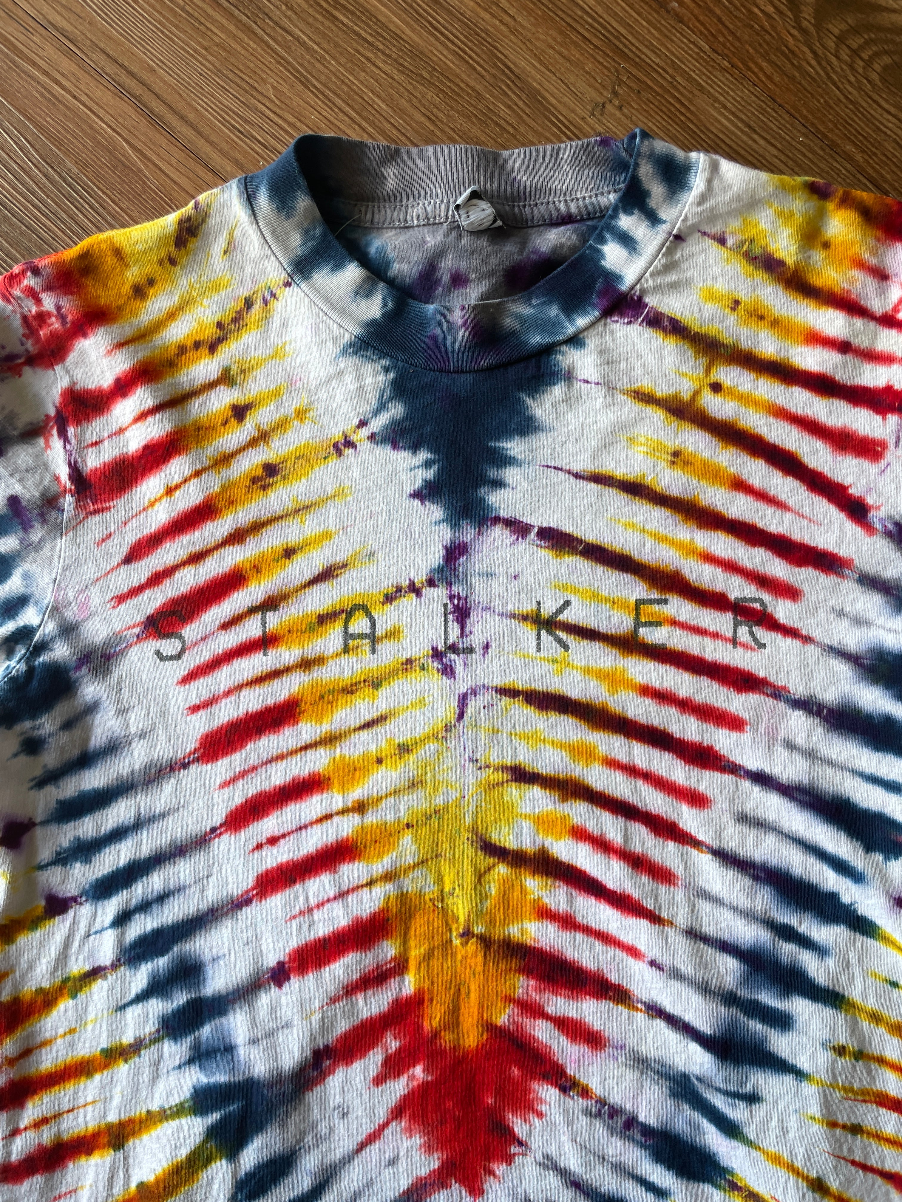 Small Men’s Local Boogeyman STALKER Handmade Tie Dye T-Shirt | Red, Orange, Yellow, and Black Pleated Tie Dye Short Sleeve
