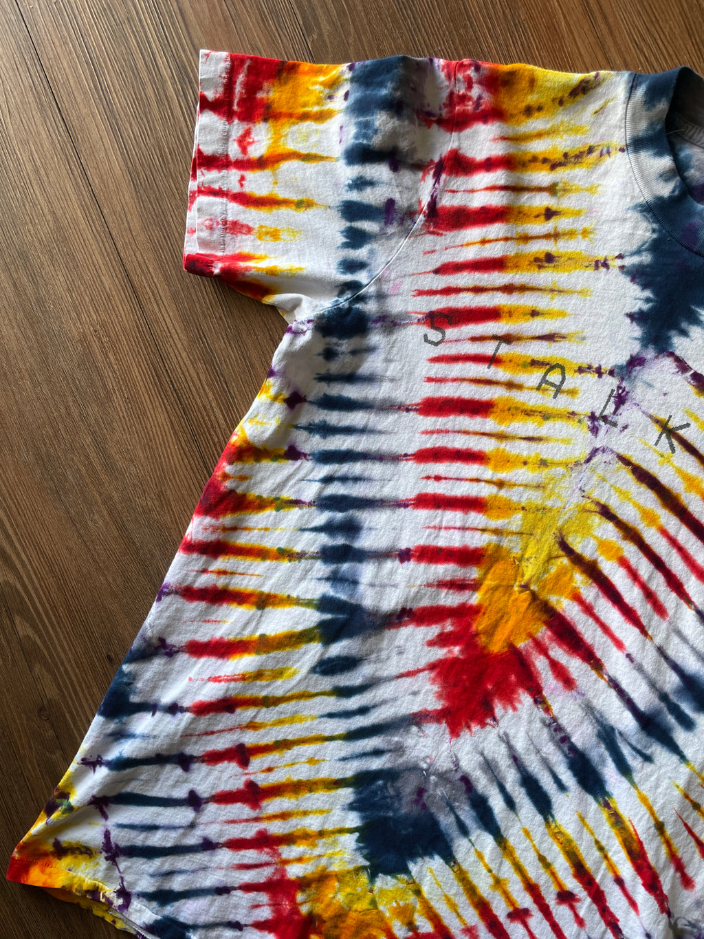 Small Men’s Local Boogeyman STALKER Handmade Tie Dye T-Shirt | Red, Orange, Yellow, and Black Pleated Tie Dye Short Sleeve