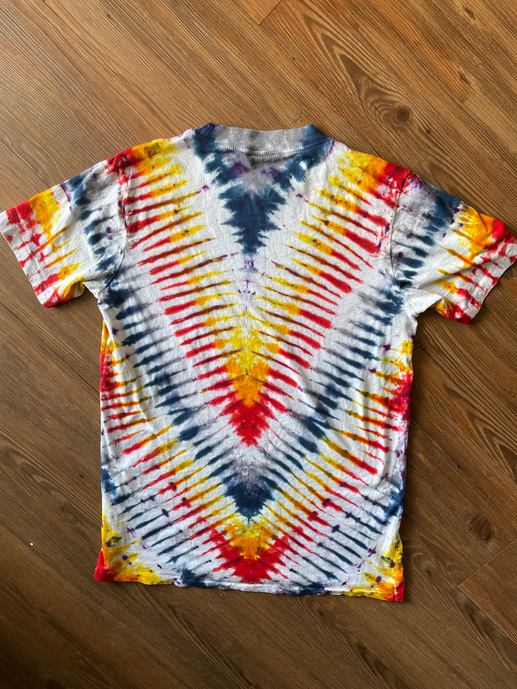 Small Men’s Local Boogeyman STALKER Handmade Tie Dye T-Shirt | Red, Orange, Yellow, and Black Pleated Tie Dye Short Sleeve