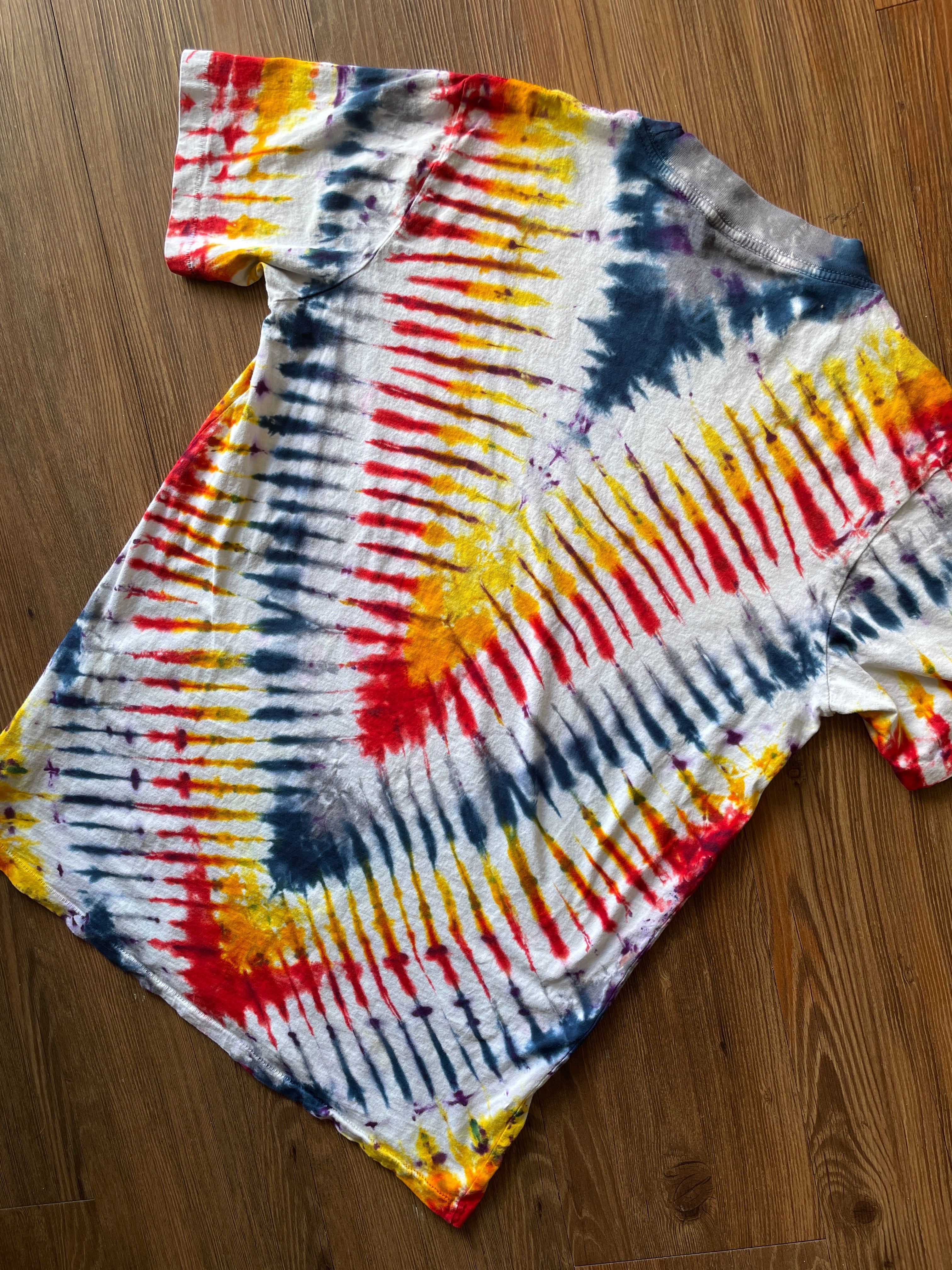 Small Men’s Local Boogeyman STALKER Handmade Tie Dye T-Shirt | Red, Orange, Yellow, and Black Pleated Tie Dye Short Sleeve