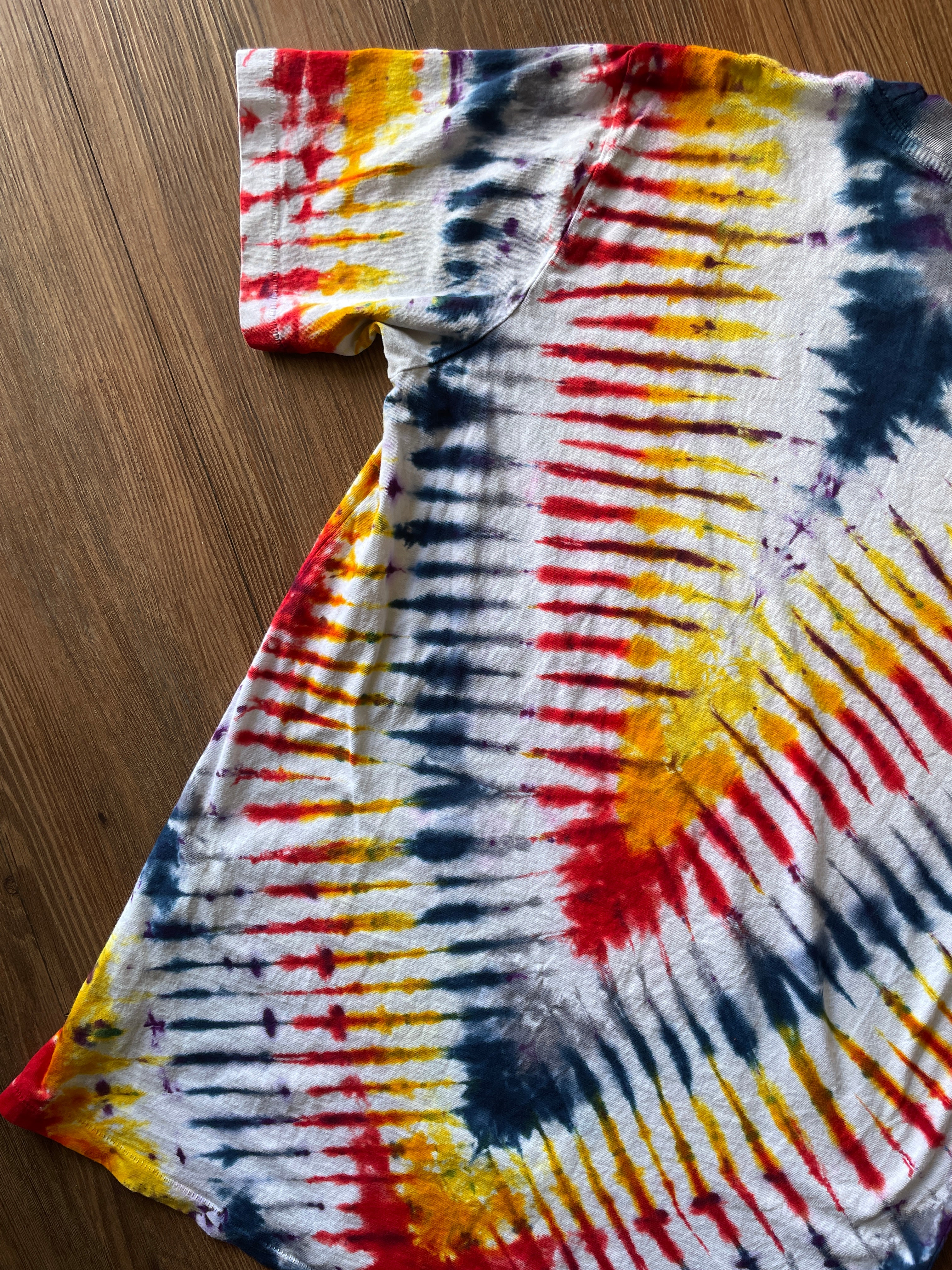 Small Men’s Local Boogeyman STALKER Handmade Tie Dye T-Shirt | Red, Orange, Yellow, and Black Pleated Tie Dye Short Sleeve