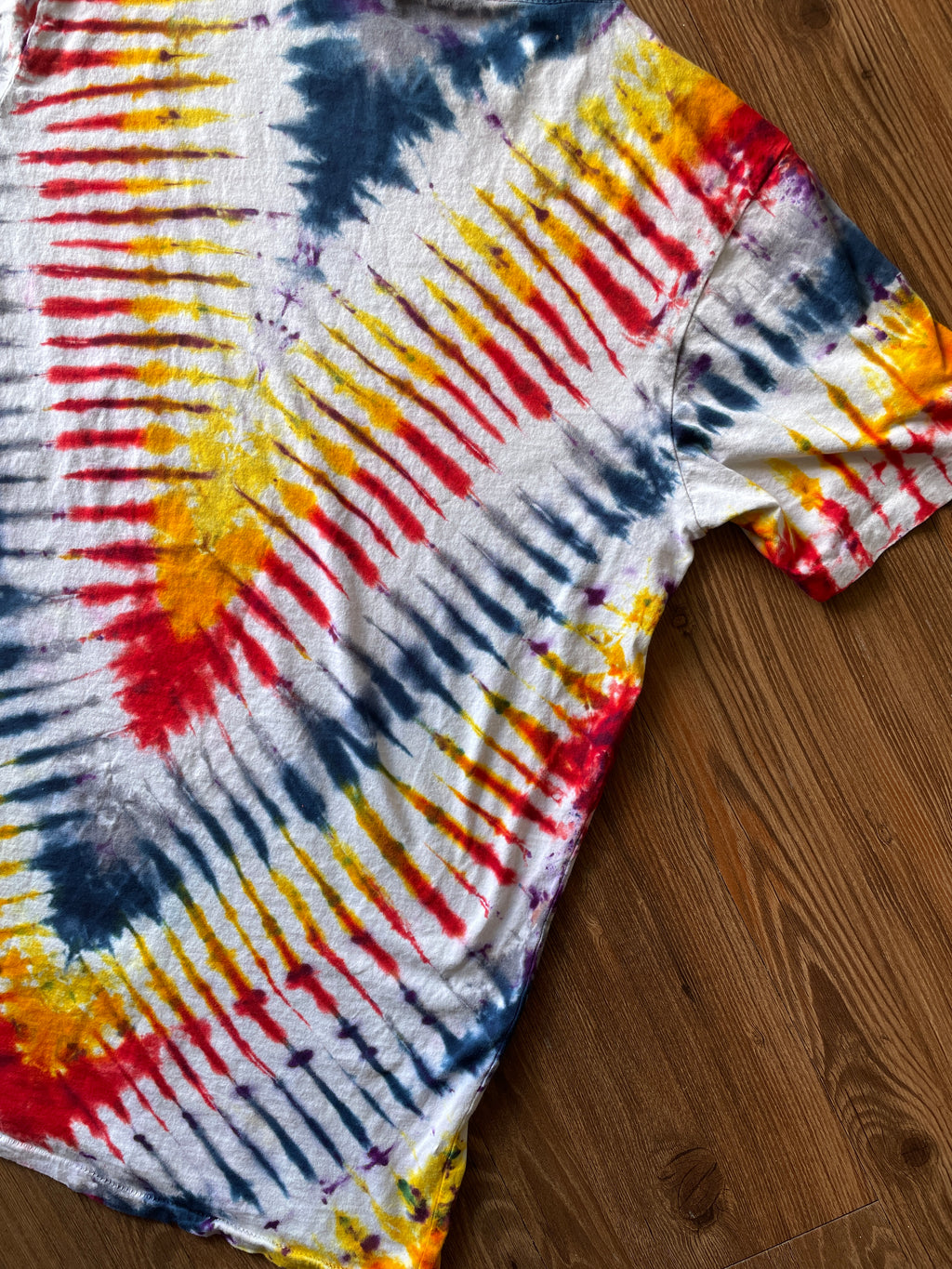 Small Men’s Local Boogeyman STALKER Handmade Tie Dye T-Shirt | Red, Orange, Yellow, and Black Pleated Tie Dye Short Sleeve