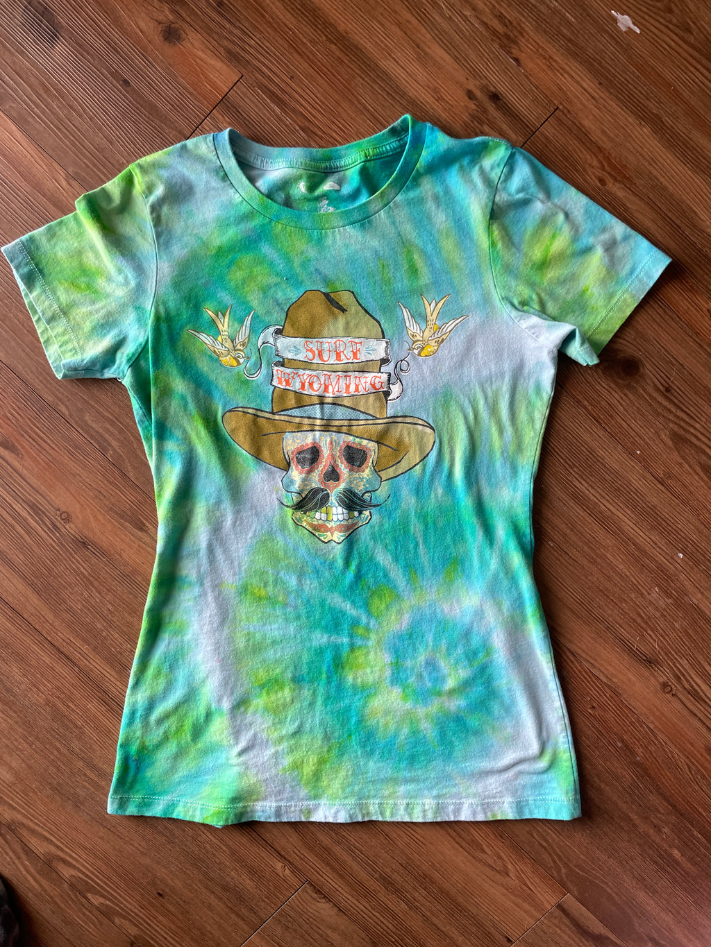 LARGE Women’s Surf Wyoming Dias de Los Muertos Sundance Kid Sugar Skull Handmade Tie Dye T-Shirt | One-Of-a-Kind Pastel Green and Blue Spiral Short Sleeve