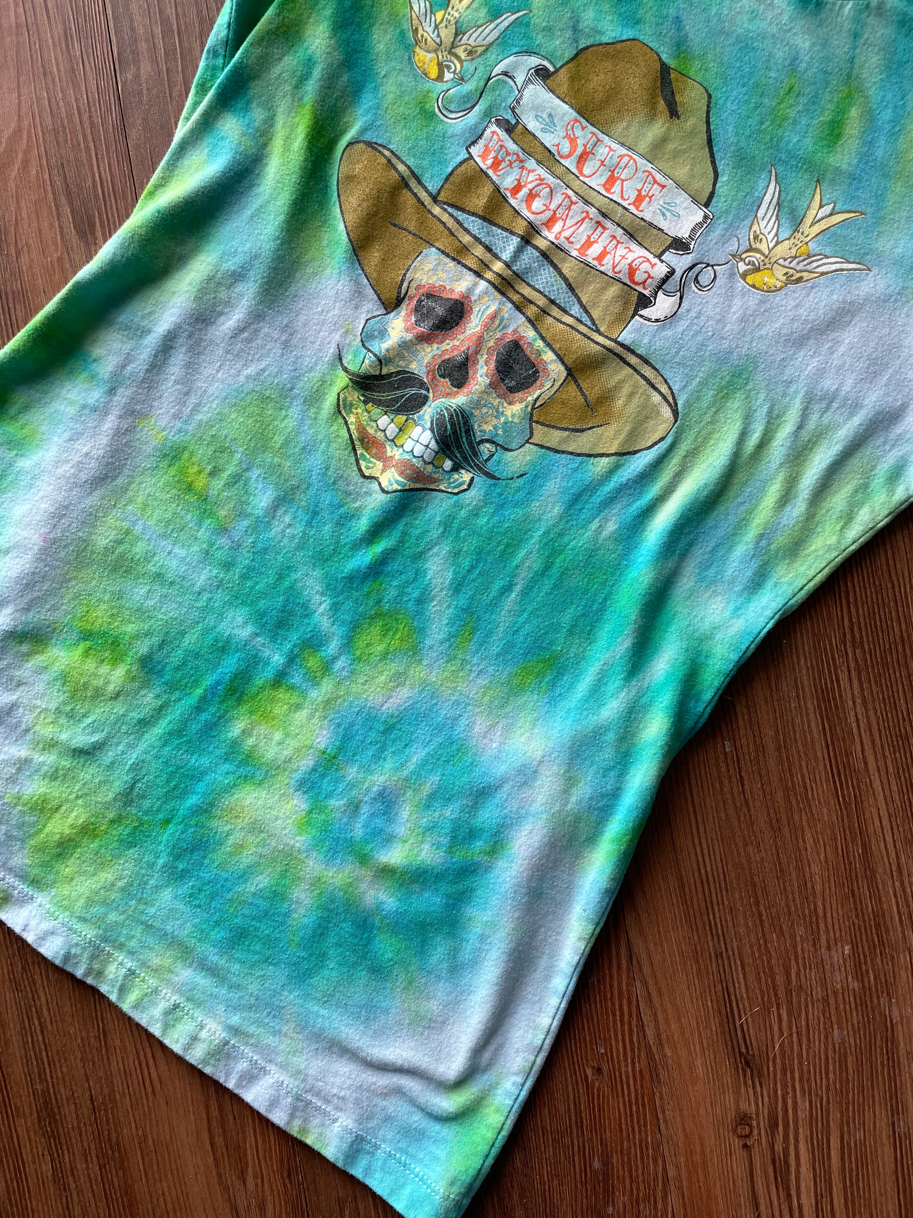 LARGE Women’s Surf Wyoming Dias de Los Muertos Sundance Kid Sugar Skull Handmade Tie Dye T-Shirt | One-Of-a-Kind Pastel Green and Blue Spiral Short Sleeve