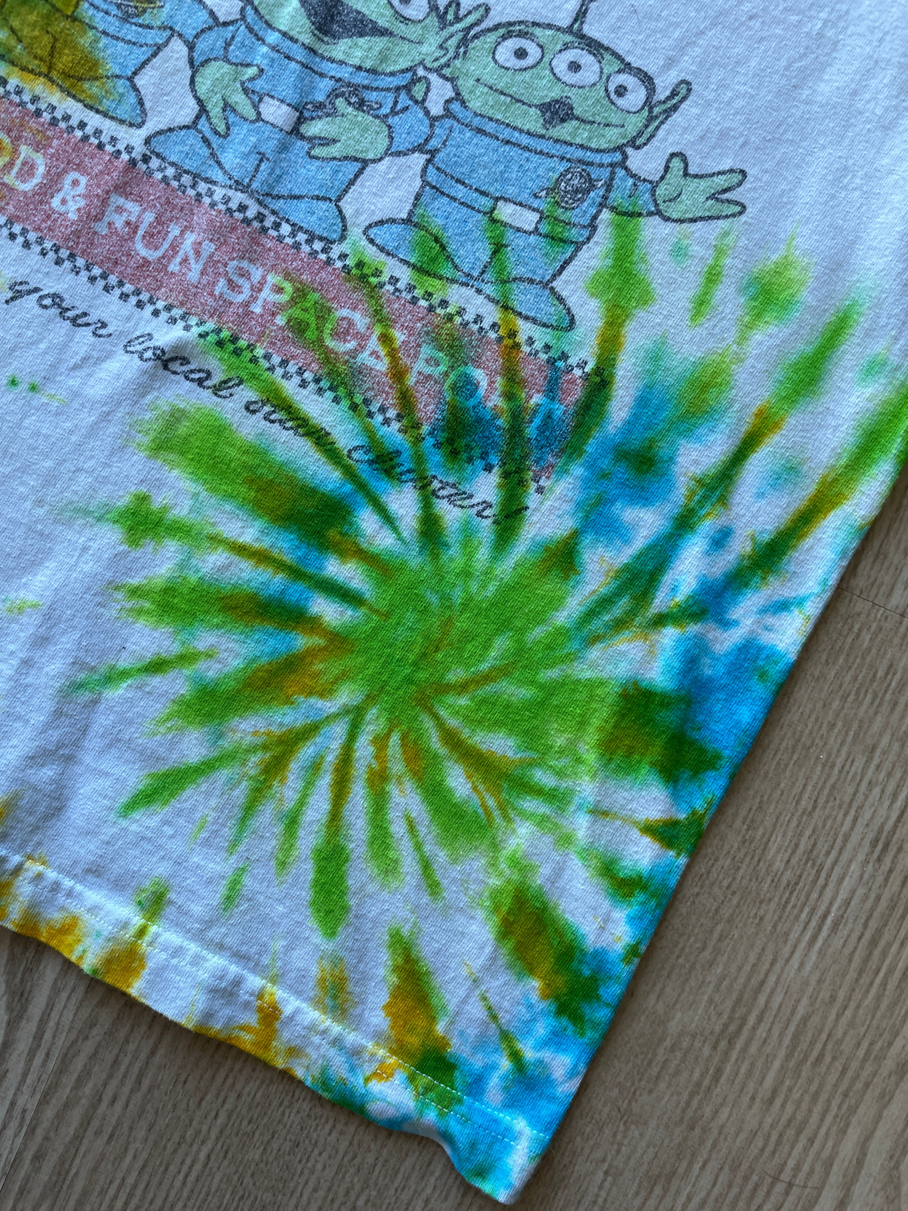 SMALL Men’s Toy Story Pizza Planet Handmade Tie Dye T-Shirt | One-Of-a-Kind Green, Blue, and Yellow Spiral Short Sleeve