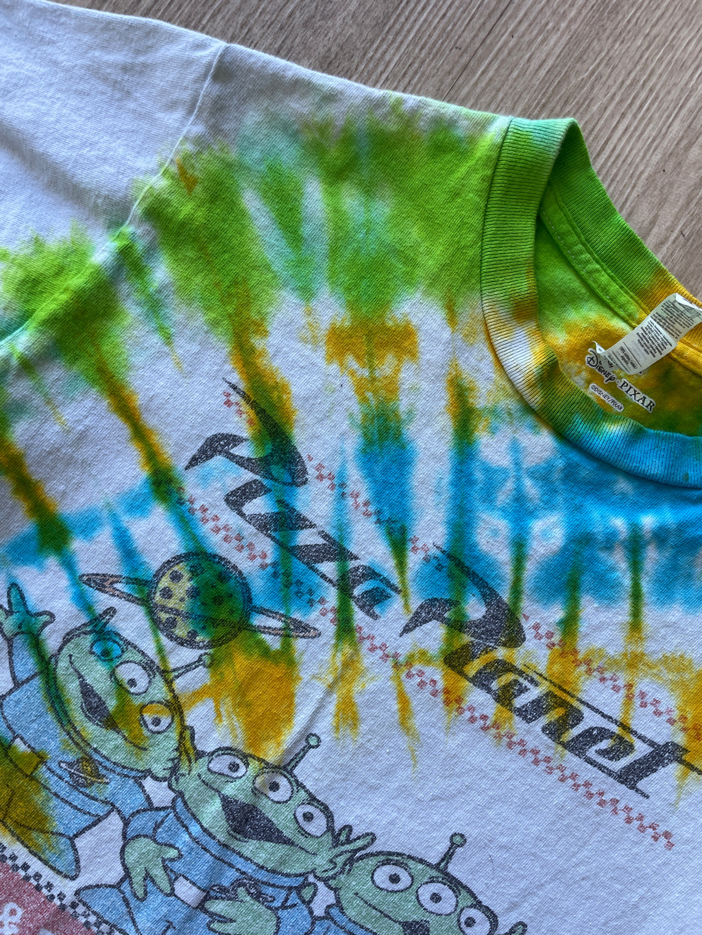 SMALL Men’s Toy Story Pizza Planet Handmade Tie Dye T-Shirt | One-Of-a-Kind Green, Blue, and Yellow Spiral Short Sleeve