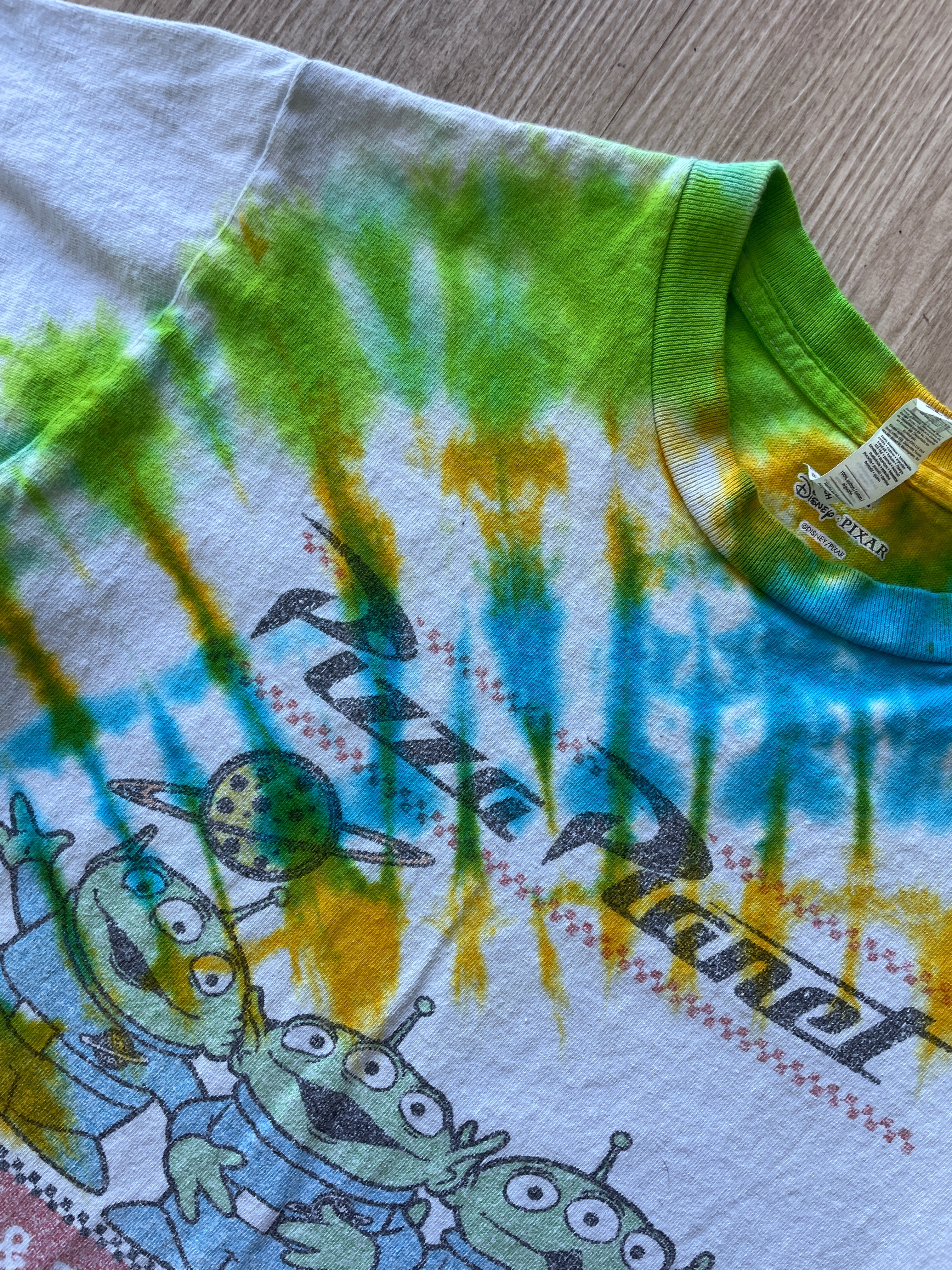 SMALL Men’s Toy Story Pizza Planet Handmade Tie Dye T-Shirt | One-Of-a-Kind Green, Blue, and Yellow Spiral Short Sleeve