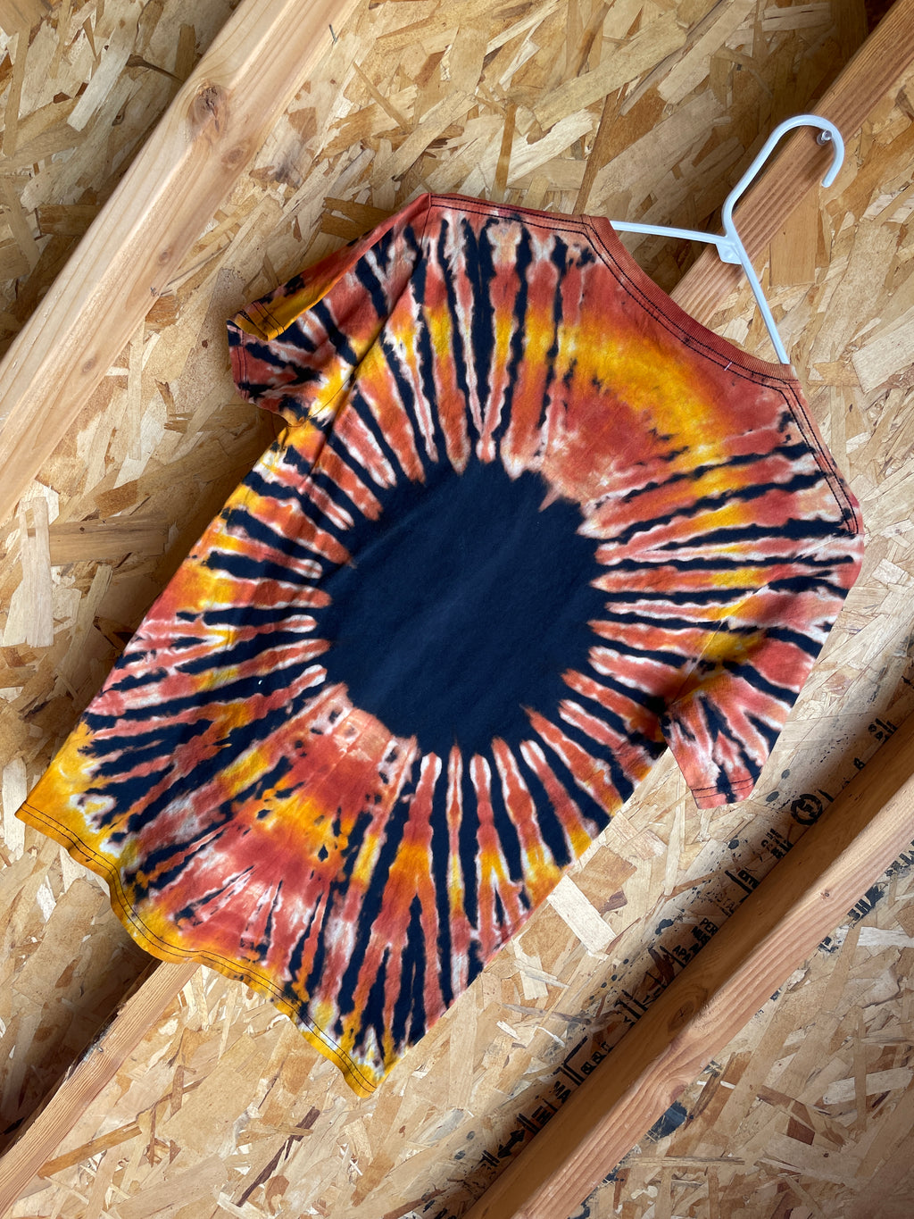 Small Men’s Big Foot Hide & Seek World Champ Handmade Tie Dye T-Shirt | Black, Brown, and Orange Pleated Tie Dye Short Sleeve