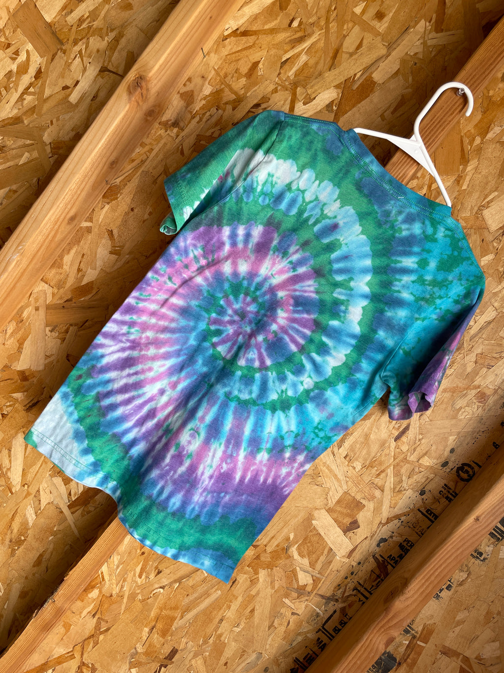 Medium women’s Happy Camper Handmade Tie Dye T-Shirt | Green, Pink, and Blue Spiral Tie Dye Short Sleeve