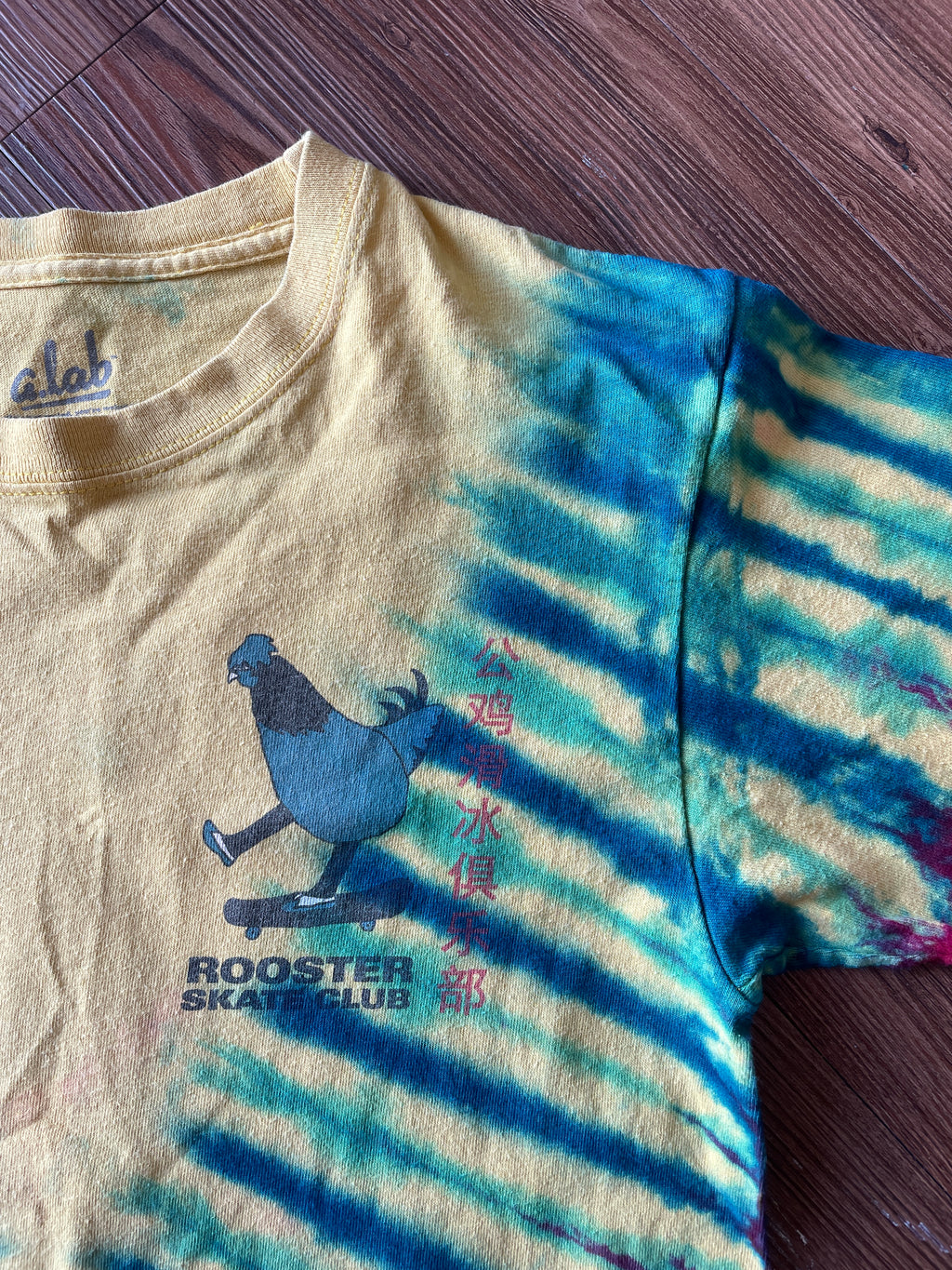 SMALL Men’s Rooster Skate Club Tie Dye T-Shirt | Yellow, Red, and Blue Skateboarding Tie Dye Short Sleeve