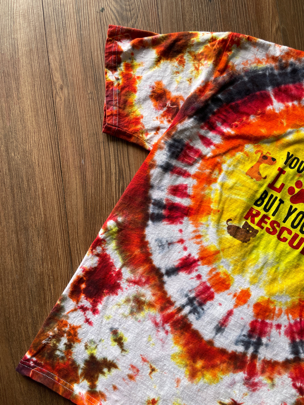 Large Men’s You Can't Buy Love But You Can Rescue It Handmade Tie Dye T-Shirt | Red, Orange, and Yellow Crumpled Tie Dye Short Sleeve