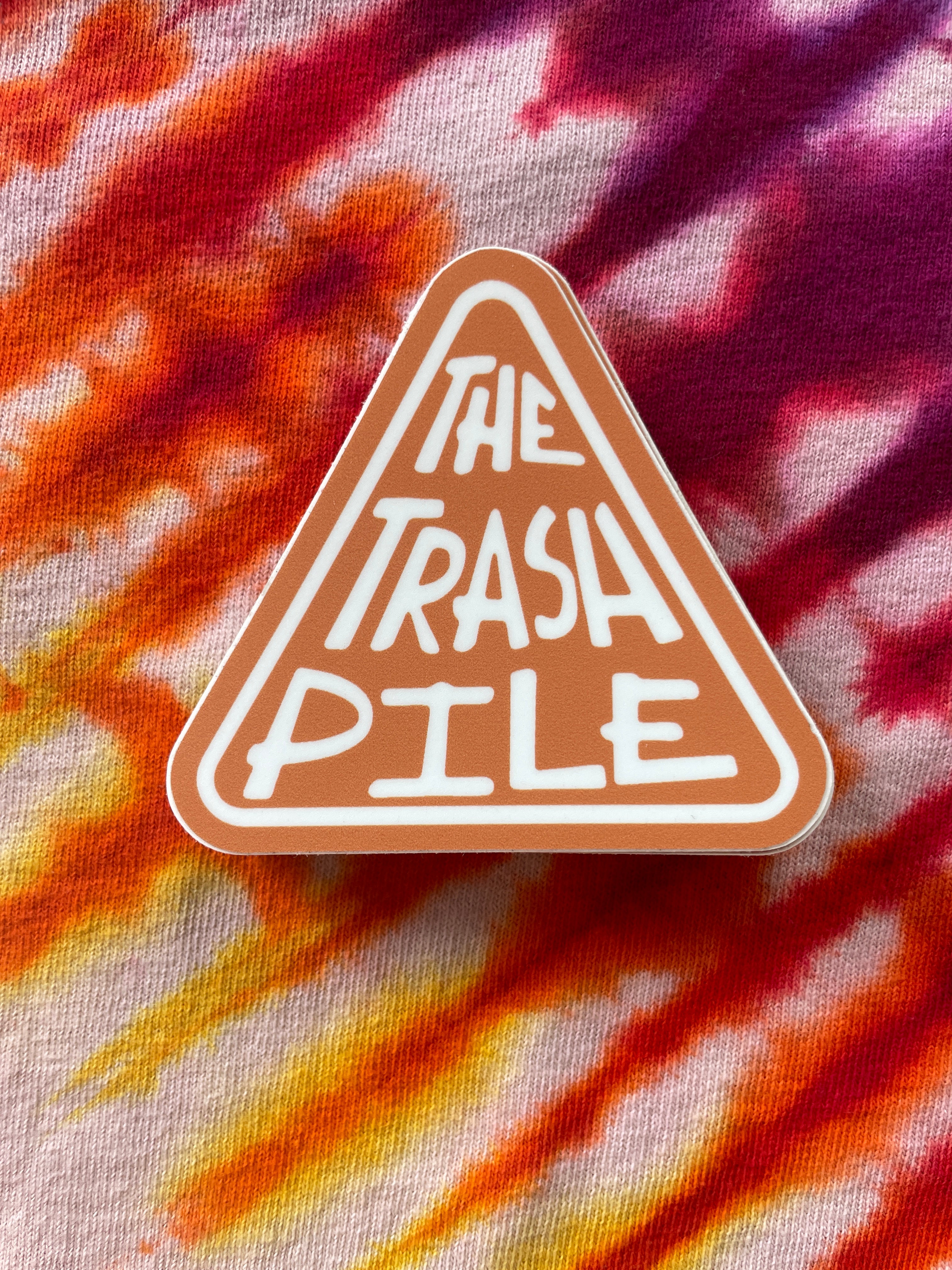 The Trash Pile Logo Sticker—Orange