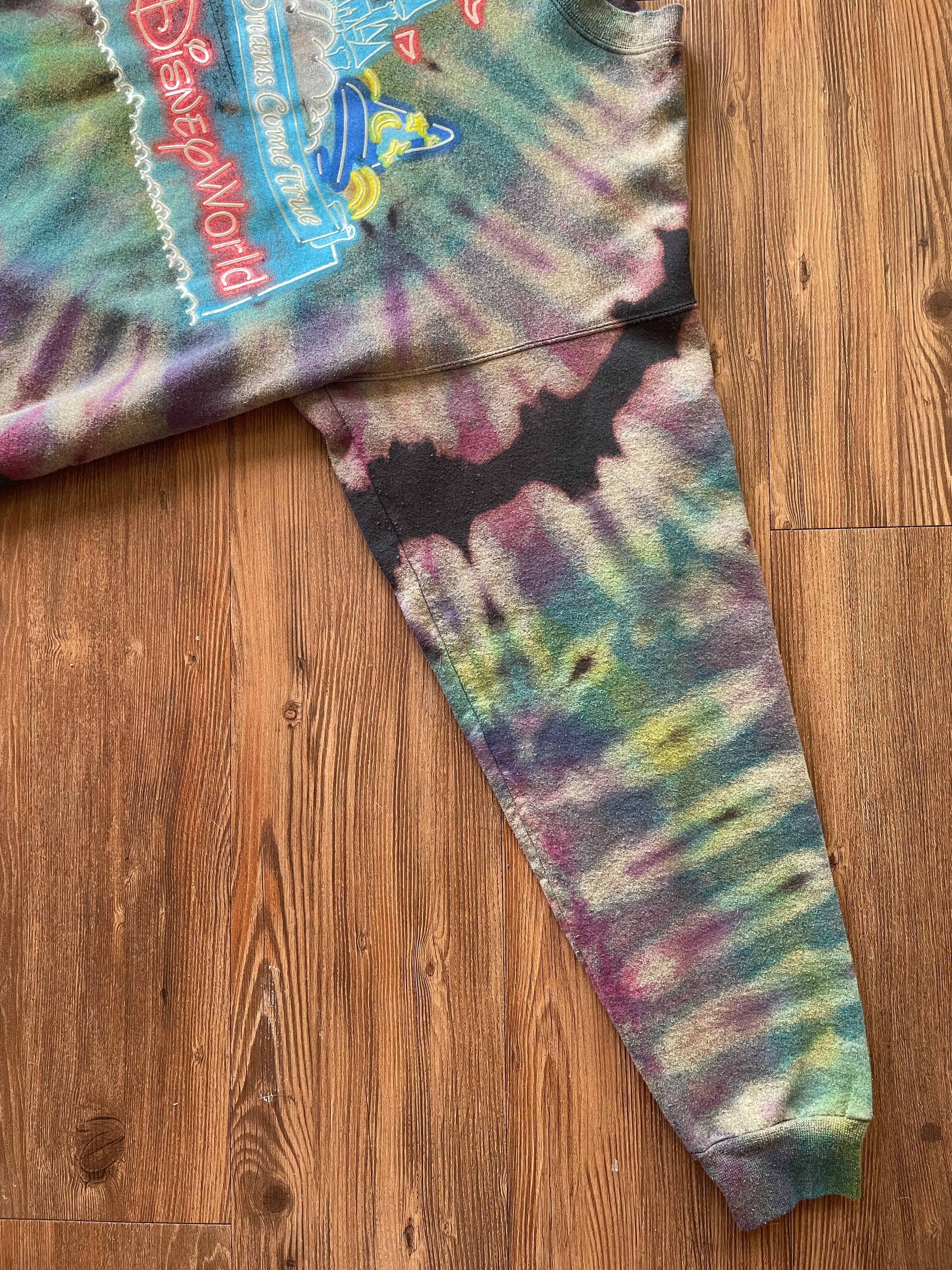 MEDIUM Men’s Walt Disney World Castle Reverse Tie Dye Sweatshirt | Black, Pink, and Purple Pleats Reverse Tie Dye Long Sleeve