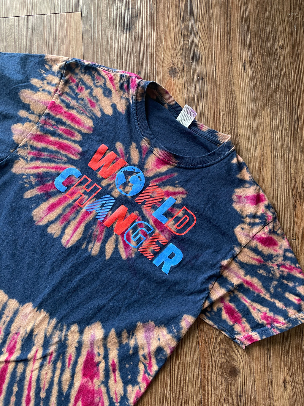 MEDIUM Men’s World Changer Reverse Tie Dye T-Shirt | Blue, Pink, and Red Spiral Tie Dye Short Sleeve Top